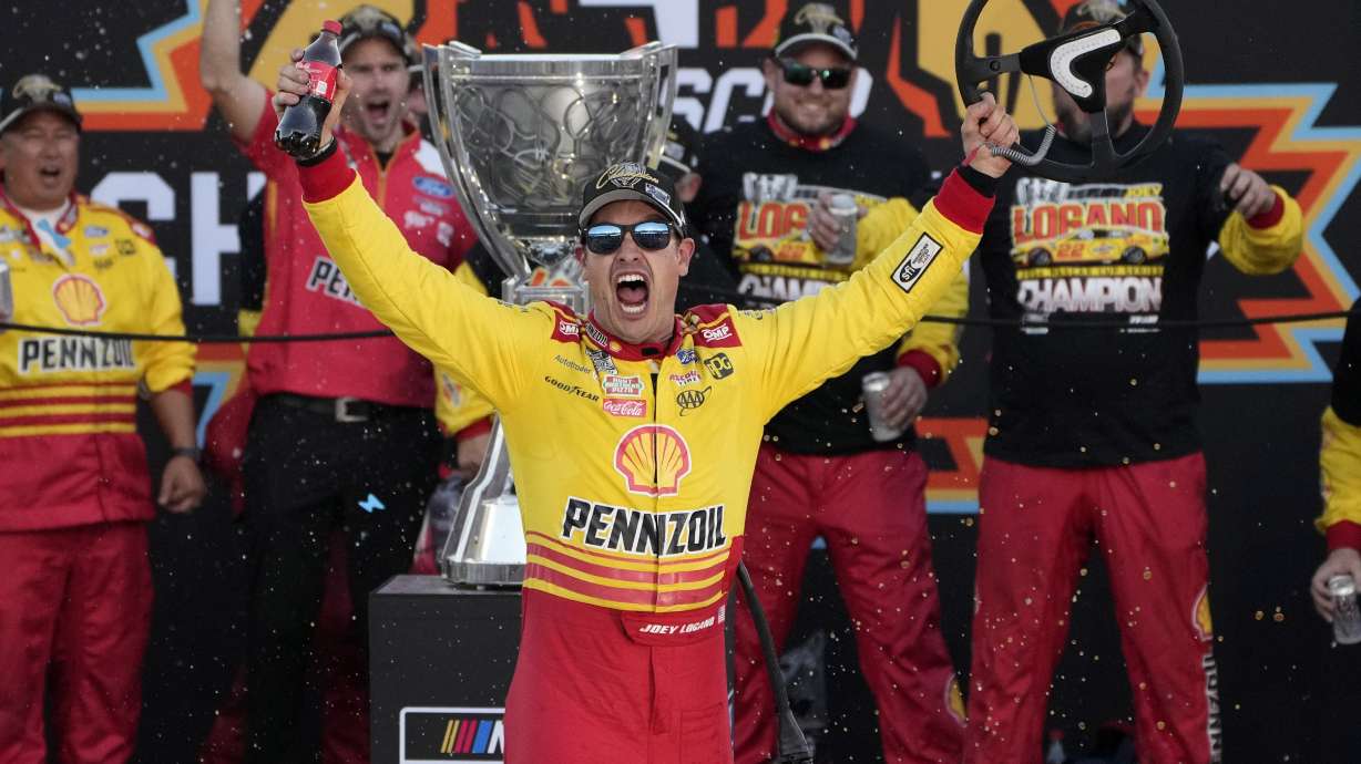 FILE - Joey Logano celebrates after winning a NASCAR Cup Series Championship auto race for the championship at Phoenix Raceway, Sunday, Nov. 10, 2024, in Avondale, Ariz.
