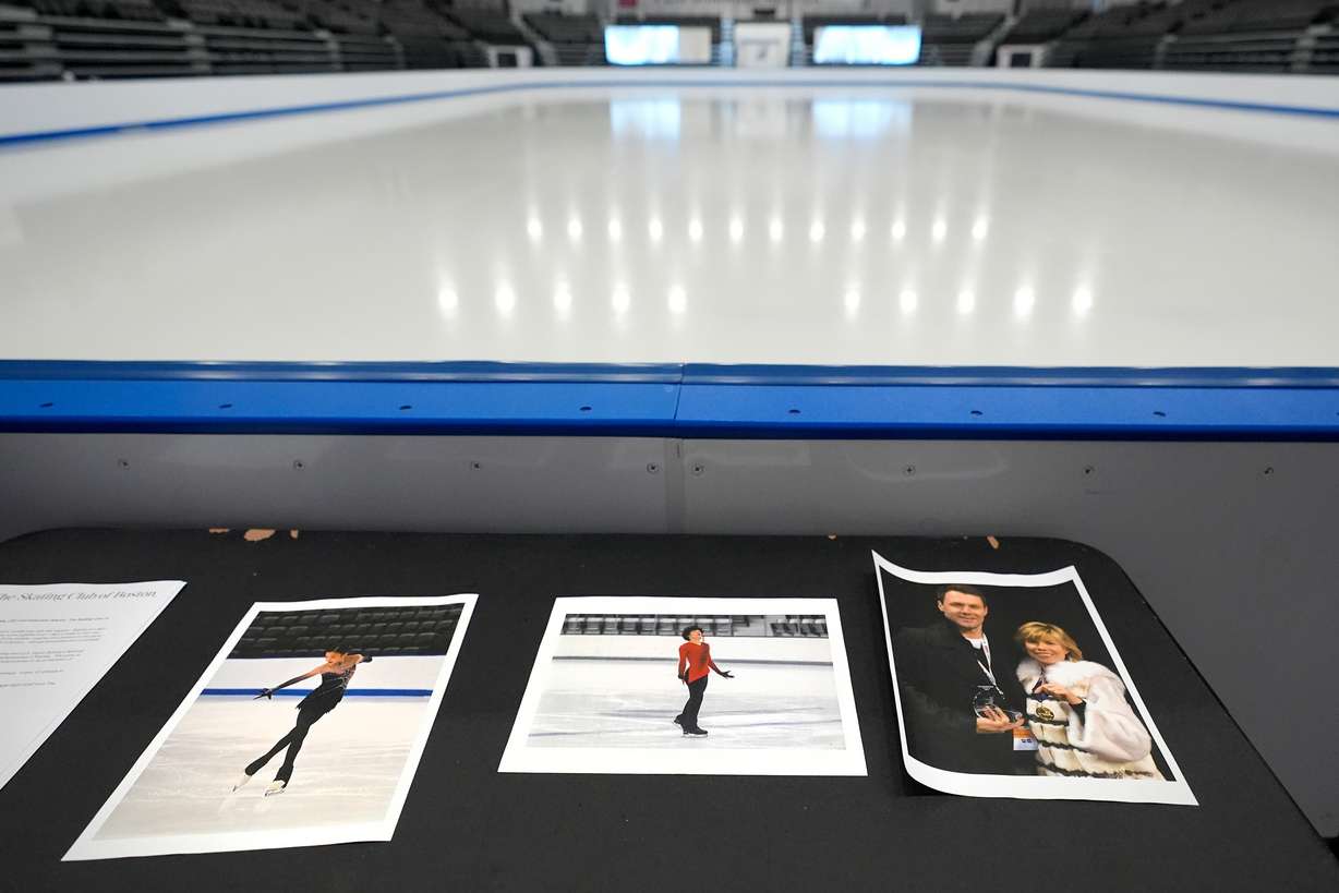 Photographs of aircraft crash victims from The Skating Club of Boston are displayed, Thursday in Norwood, Mass. From left is skater Jinna Han, skater Spencer Lane and coaches Vadim Naumov and Evgenia Shishkova.