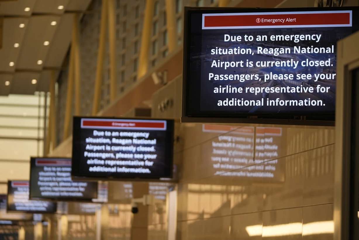 Signs display an alert at Ronald Reagan Washington National Airport Thursday in Arlington, Va.