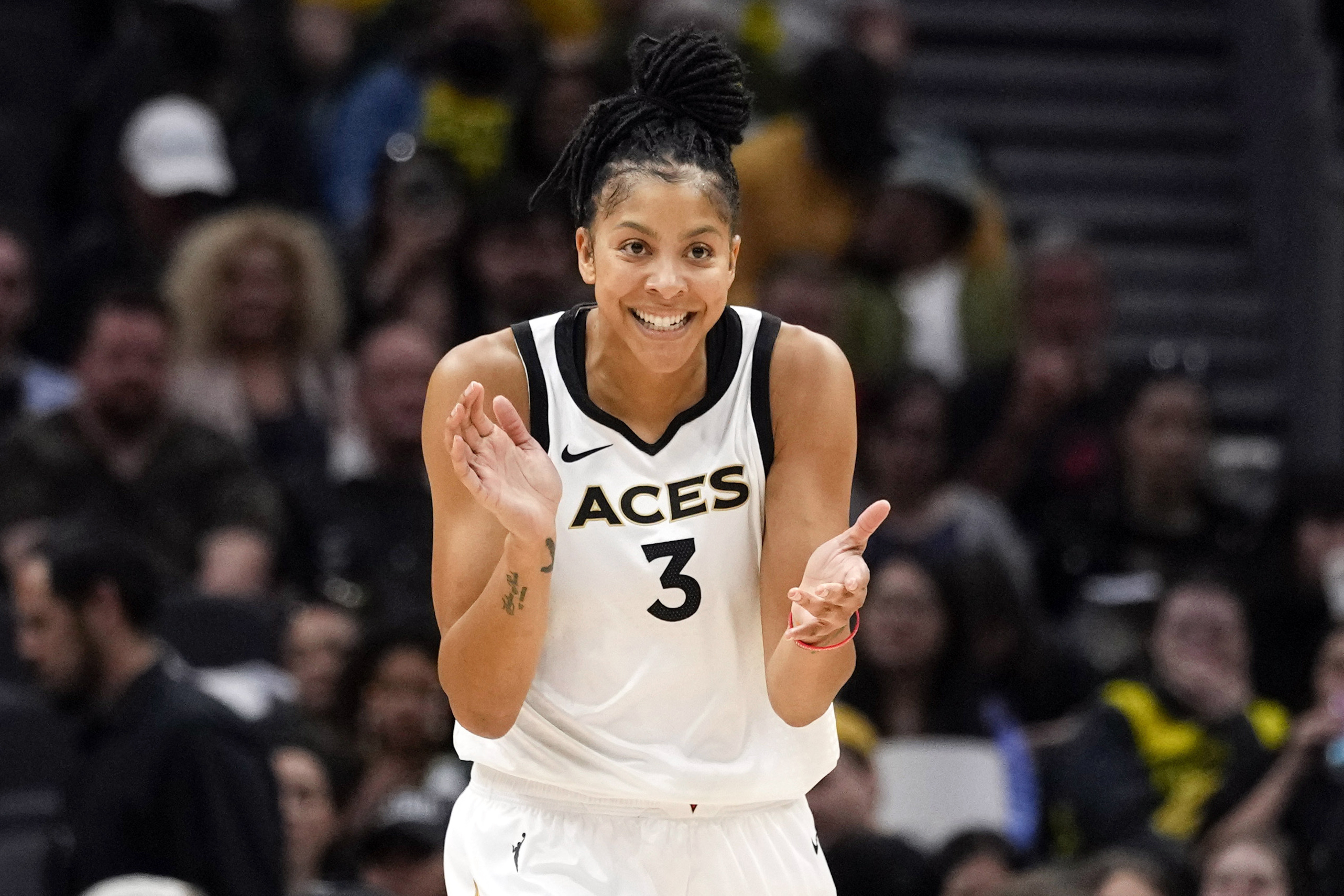 FILE - Former Las Vegas Aces forward Candace Parker reacts during the first half of a WNBA basketball game against the Seattle Storm, May 20, 2023, in Seattle. 