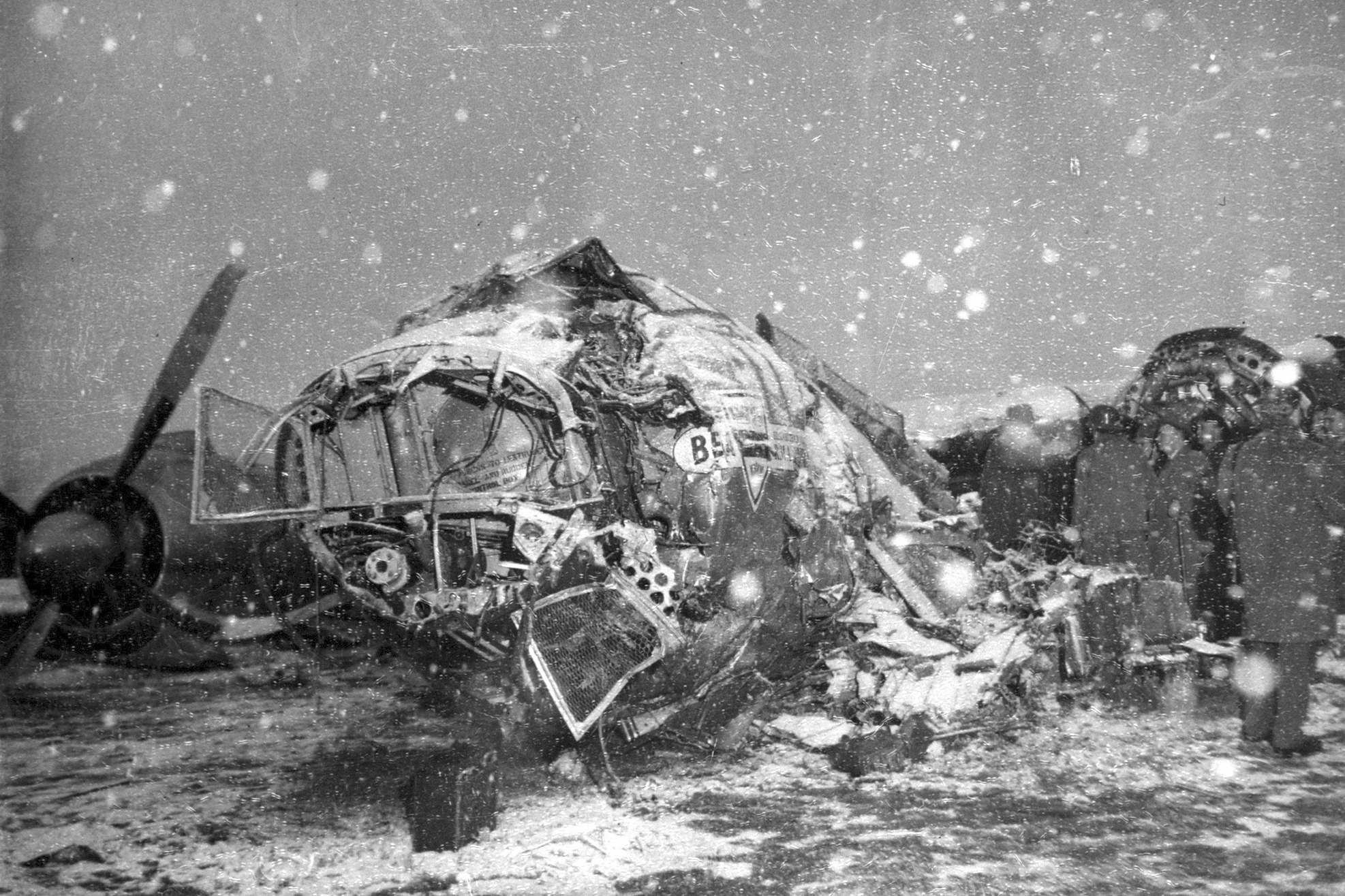 FILE - Snow falls on the wreck of a BEA Elizabethan Airliner which crashed on take-off at Munich, Germany, Feb. 6, 1958, killing 21 people, including seven members of the Manchester United football team. The Manchester United football team were returning from Yugoslavia where they had played a European Cup quarter final against Red Star Belgrade the day before. 