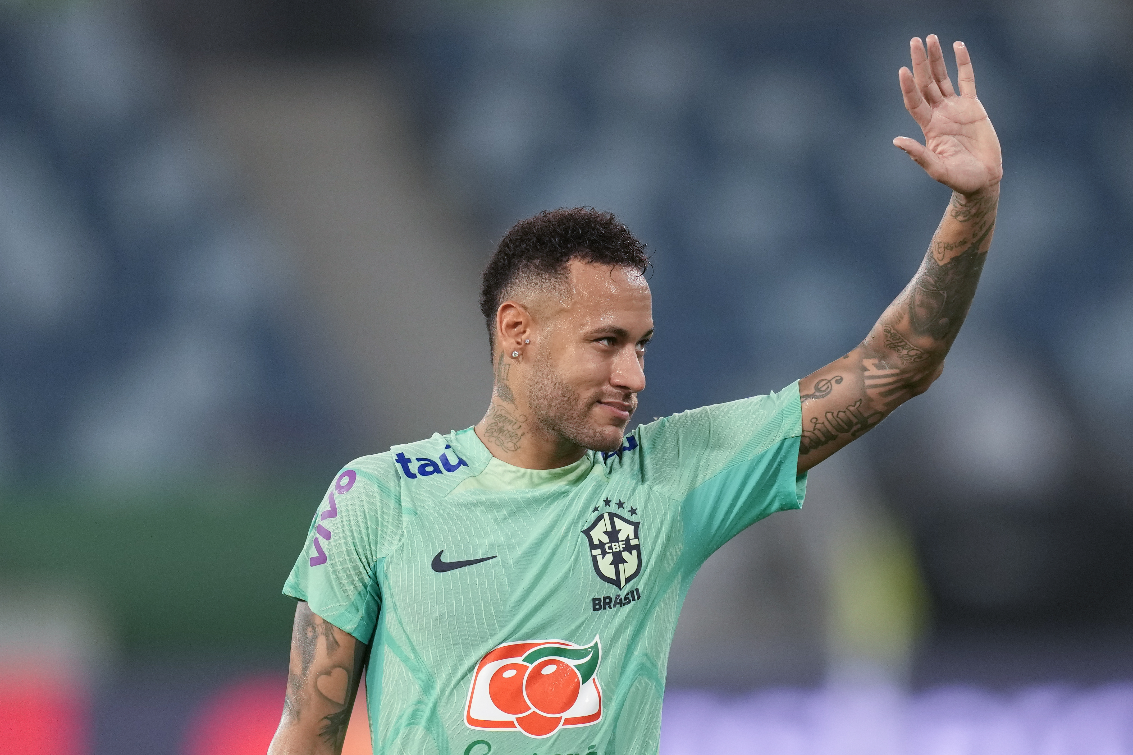FILE - Brazil's Neymar waves to fans during a training session in Cuiaba, Brazil, Tuesday, Oct. 10, 2023.