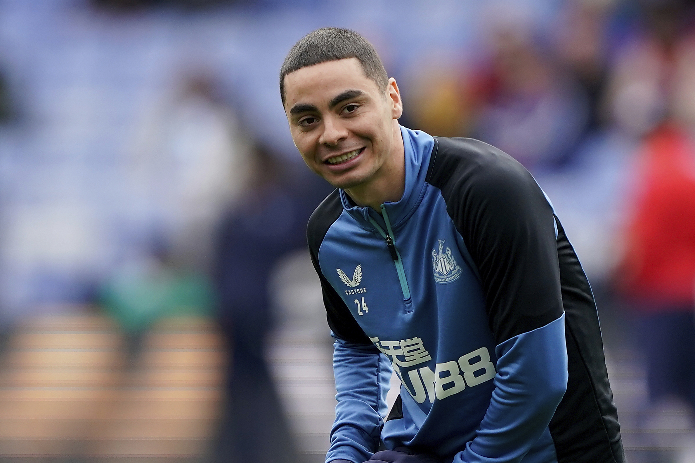 FILE - Newcastle United's Miguel Almiron warms up before the English Premier League soccer match against Crystal Palace at Selhurst Park in London, Oct. 23, 2021. 