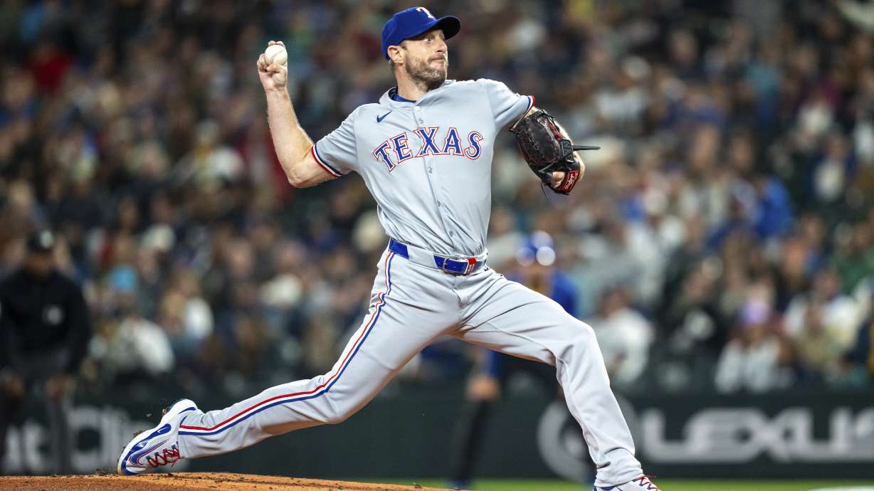 FILE - Texas Rangers starter Max Scherzer delivers a pitch during a baseball game against the Seattle Mariners, Sept. 14, 2024, in Seattle.