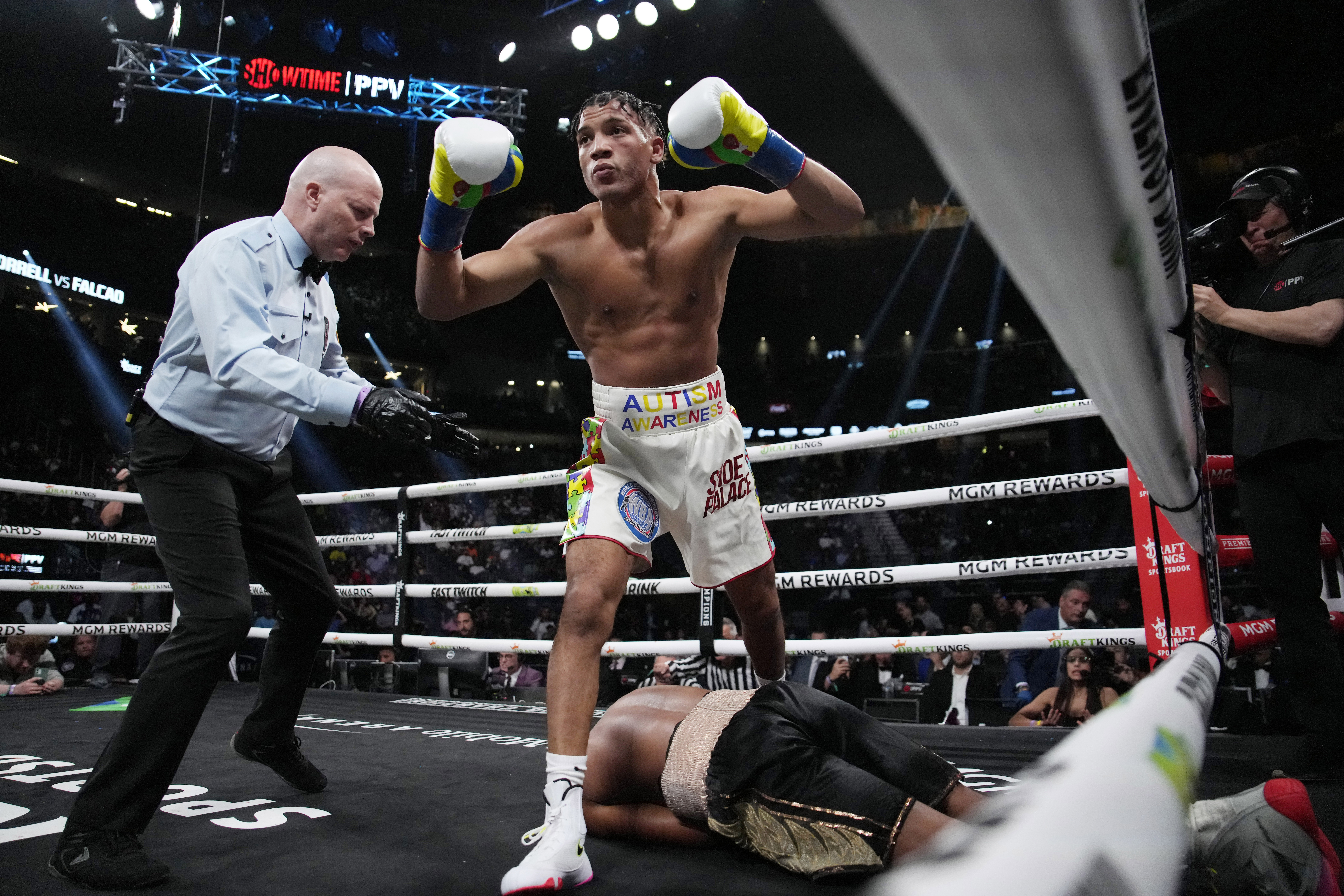 FILE 0 David Morrell Jr. steps over Yamaguchi Falcao after knocking him out during a super middleweight title boxing bout Saturday, April 22, 2023, in Las Vegas. 