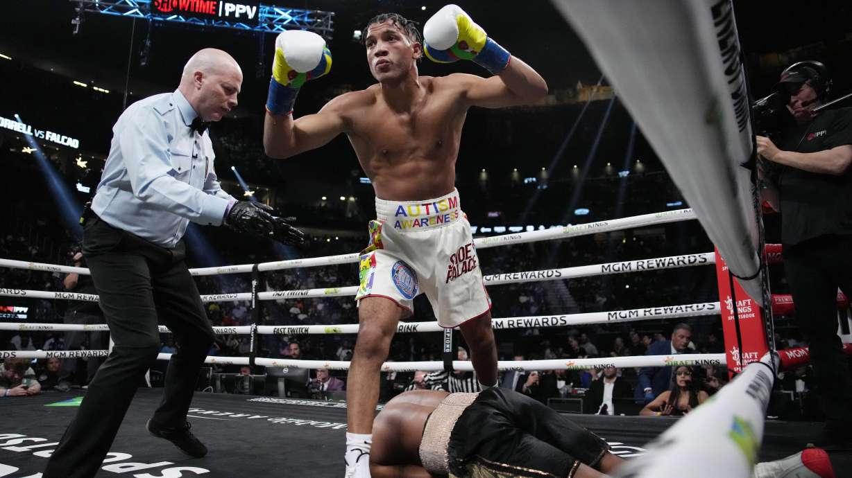 FILE 0 David Morrell Jr. steps over Yamaguchi Falcao after knocking him out during a super middleweight title boxing bout Saturday, April 22, 2023, in Las Vegas.