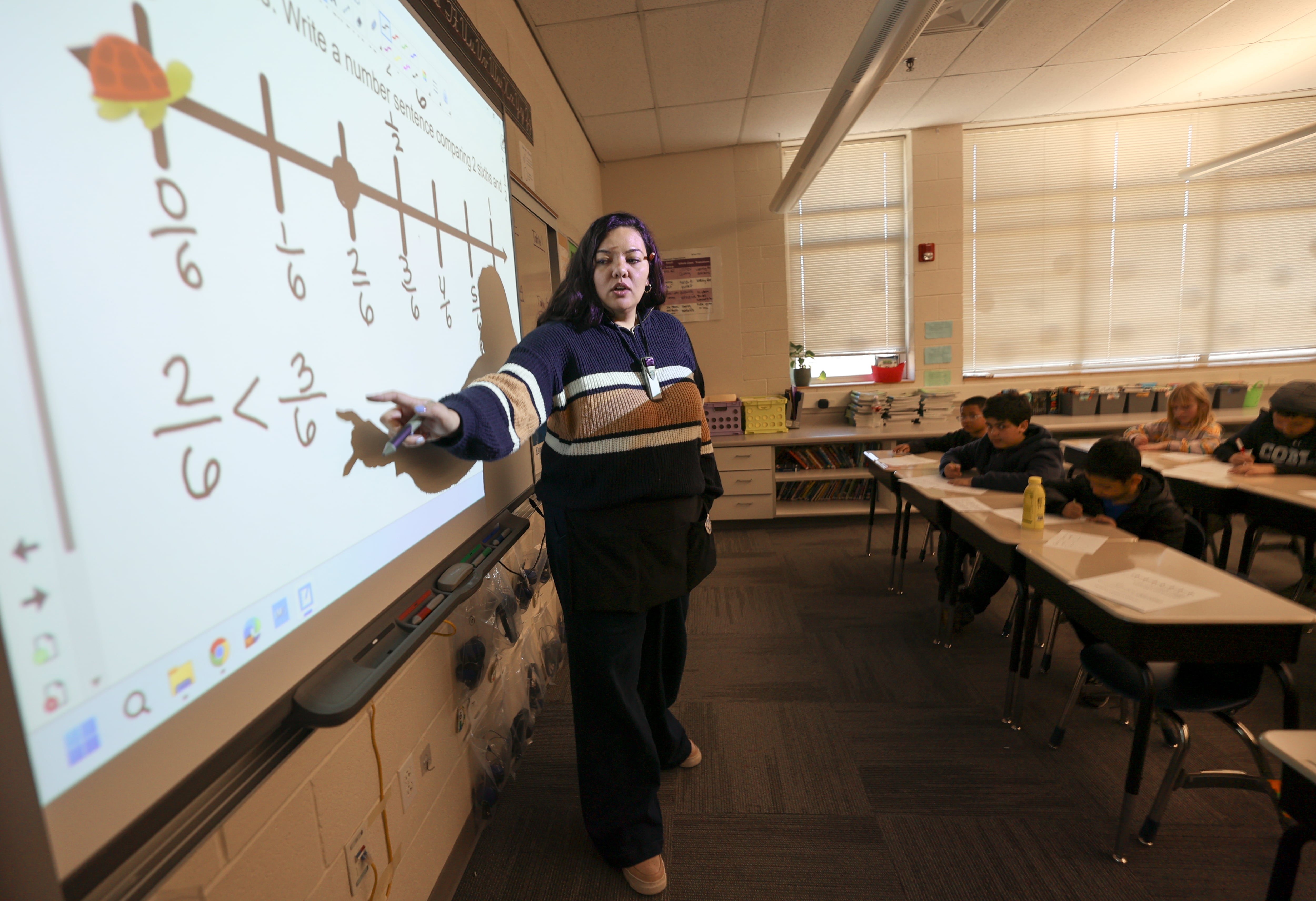 Brianna Rolf teaches math to fourth graders at Whittier Elementary School in Salt Lake City on Thursday. Results from The Nation's Report Card show Utah students doing well overall — but some areas need improvement.