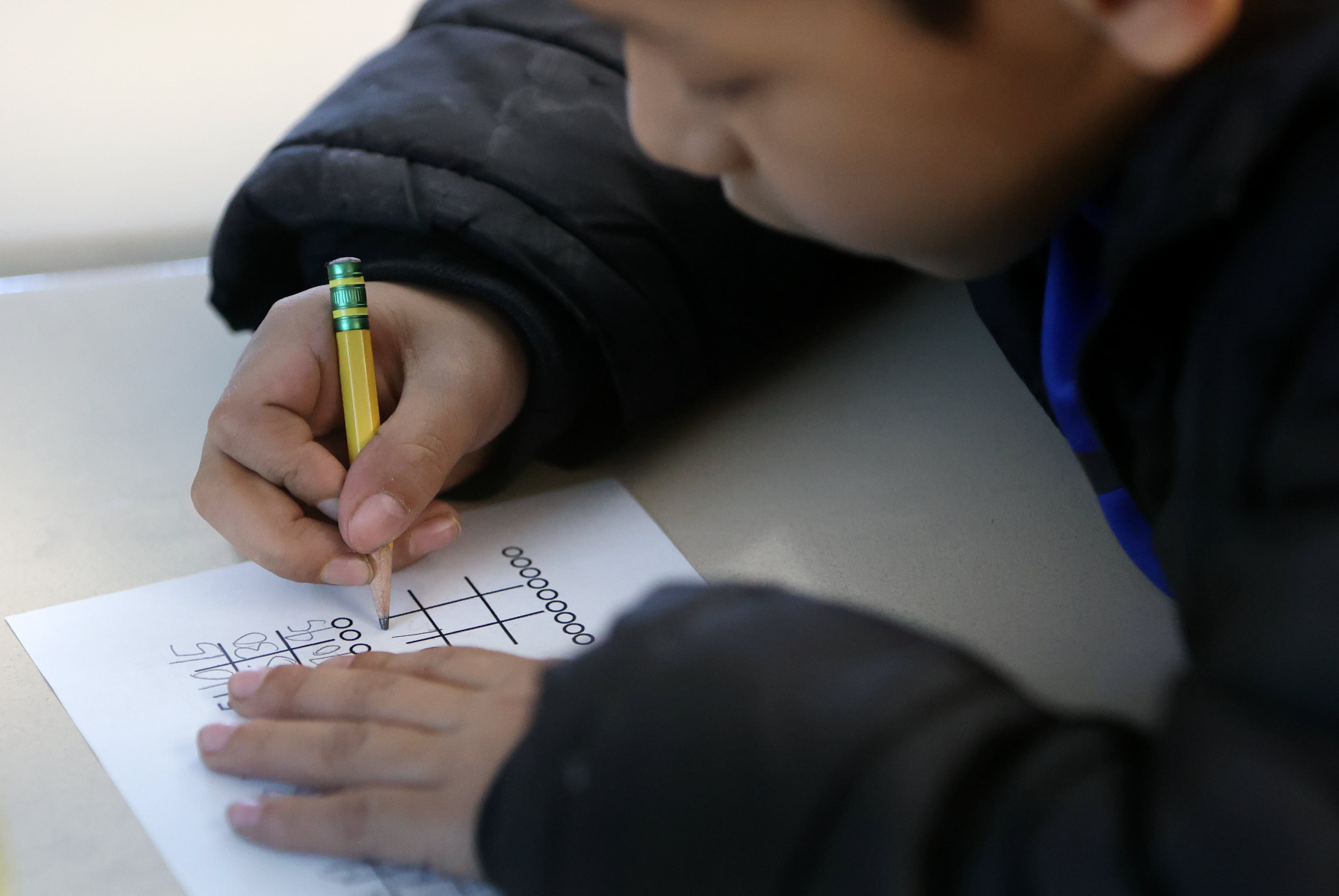 Fourth grader Edgar Galindo Alaniz works on math in Brianna Rolf’s class at Whittier Elementary School in Salt Lake City on Thursday.