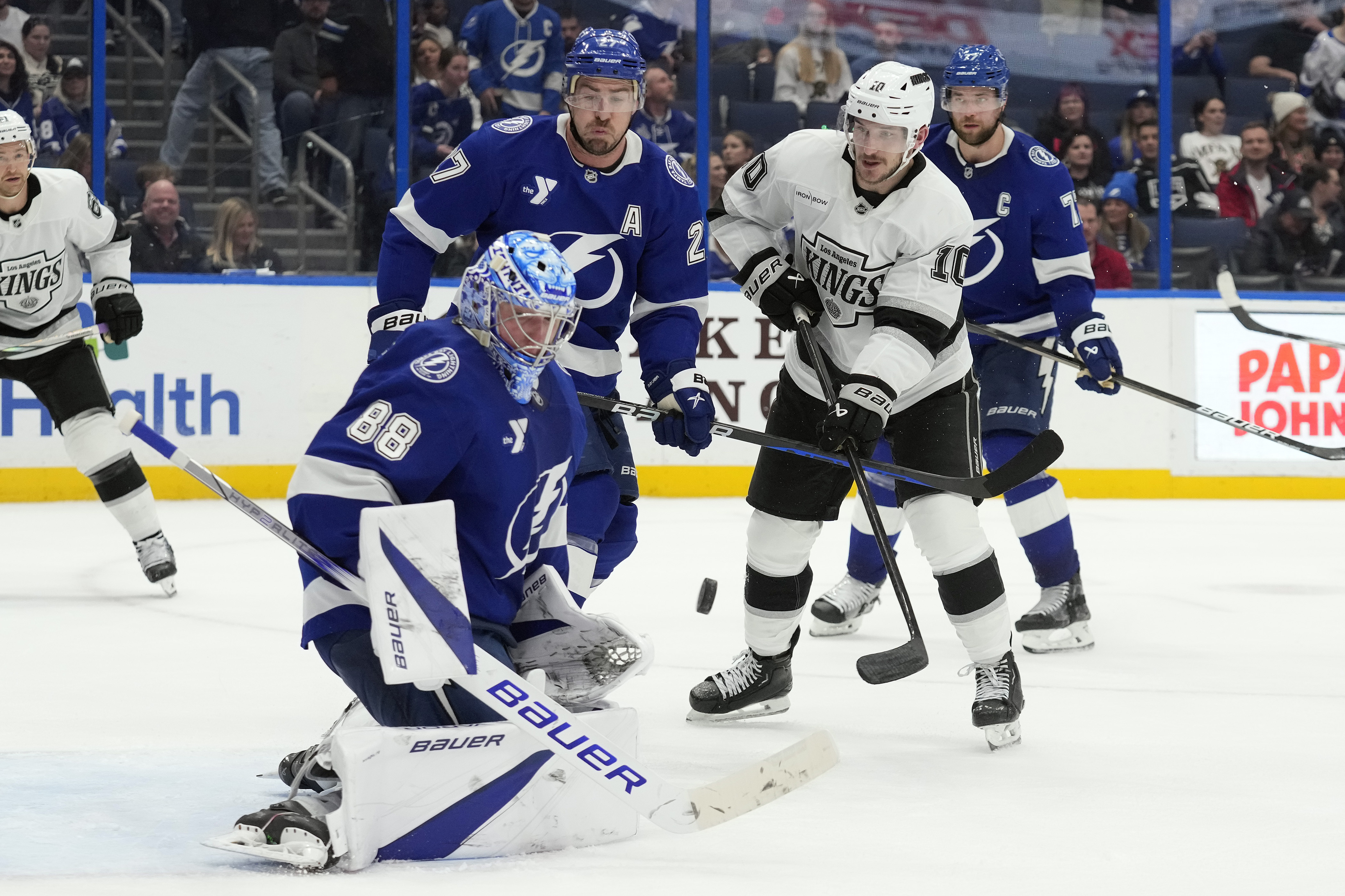 Tampa Bay Lightning goaltender Andrei Vasilevskiy (88) makes a save on a deflection by Los Angeles Kings left wing Tanner Jeannot (10) in front of defenseman Ryan McDonagh (27) during the third period of an NHL hockey game Thursday, Jan. 30, 2025, in Tampa, Fla. 