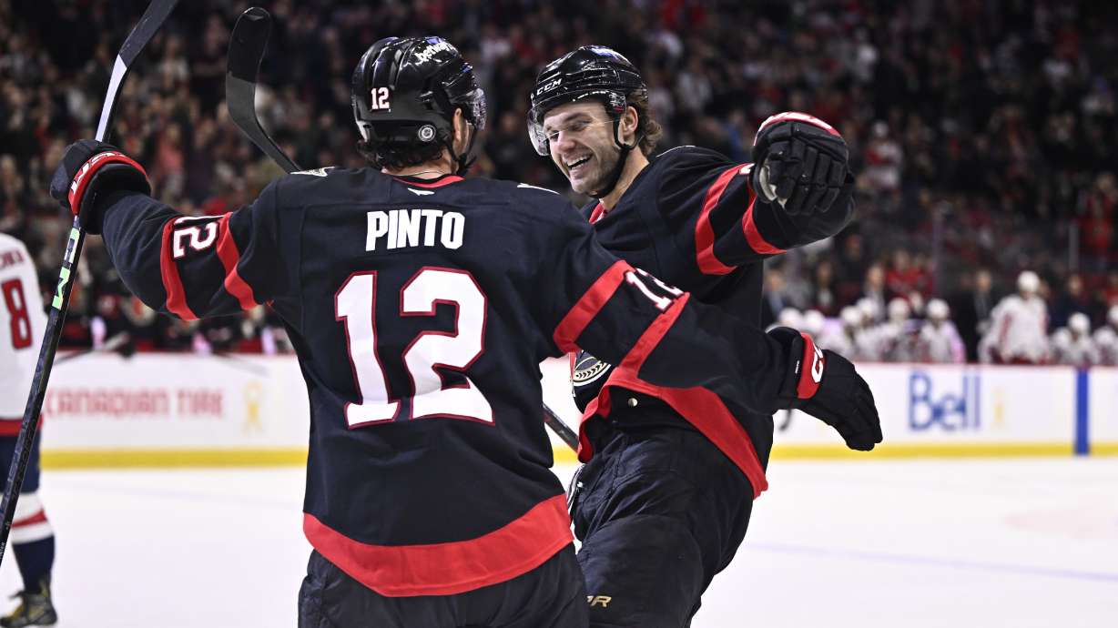 Ottawa Senators' Shane Pinto (12) celebrates his goal against the Washington Capitals with Josh Norris (9) during second period NHL hockey action in Ottawa, on Thursday, Jan. 30, 2025.