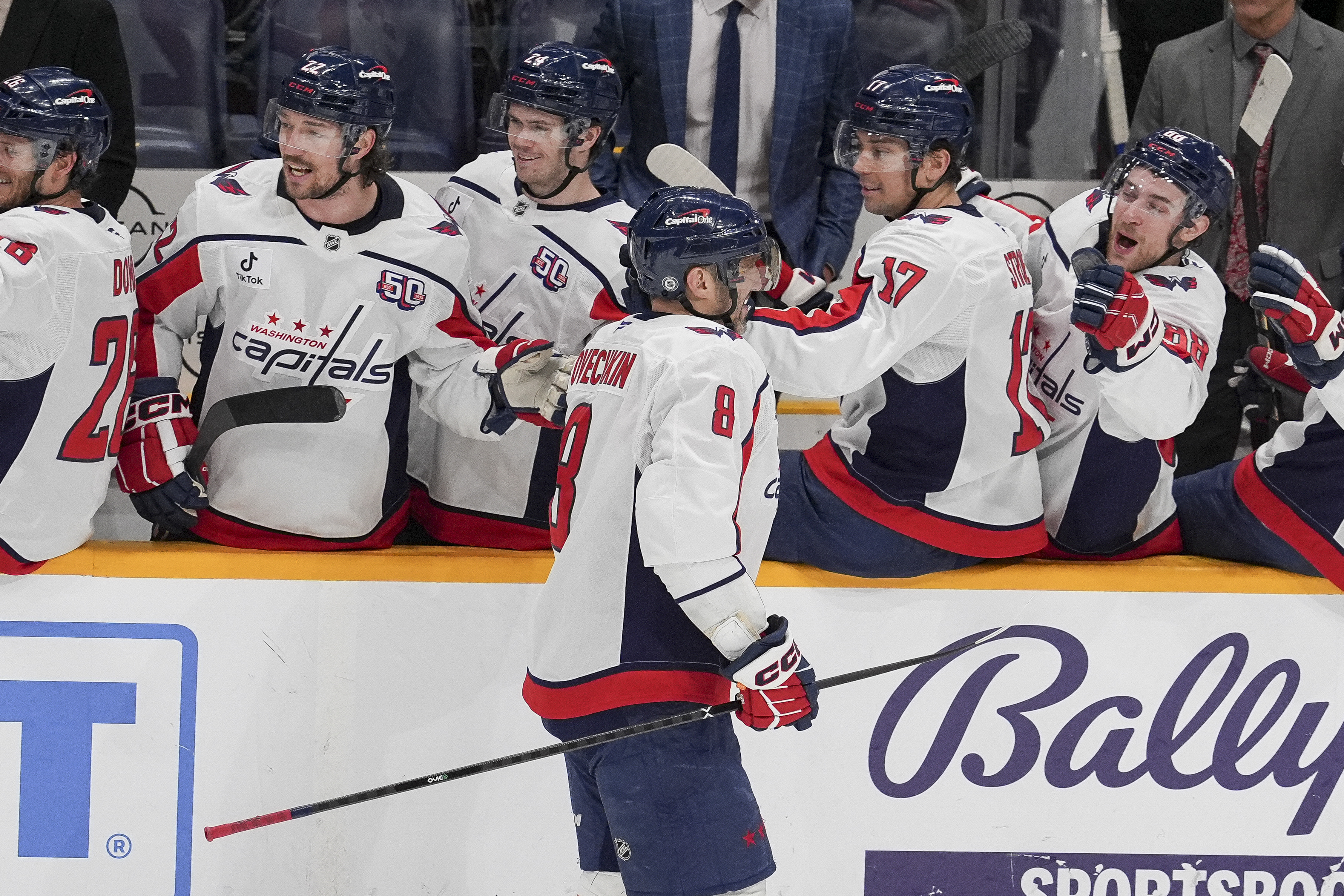 Washington Capitals left wing Alex Ovechkin (8) celebrates his empty net goal with teammates during the third period of an NHL hockey game against the Nashville Predators, Saturday, Jan. 11, 2025, in Nashville, Tenn. The Capitals won 4-1. 