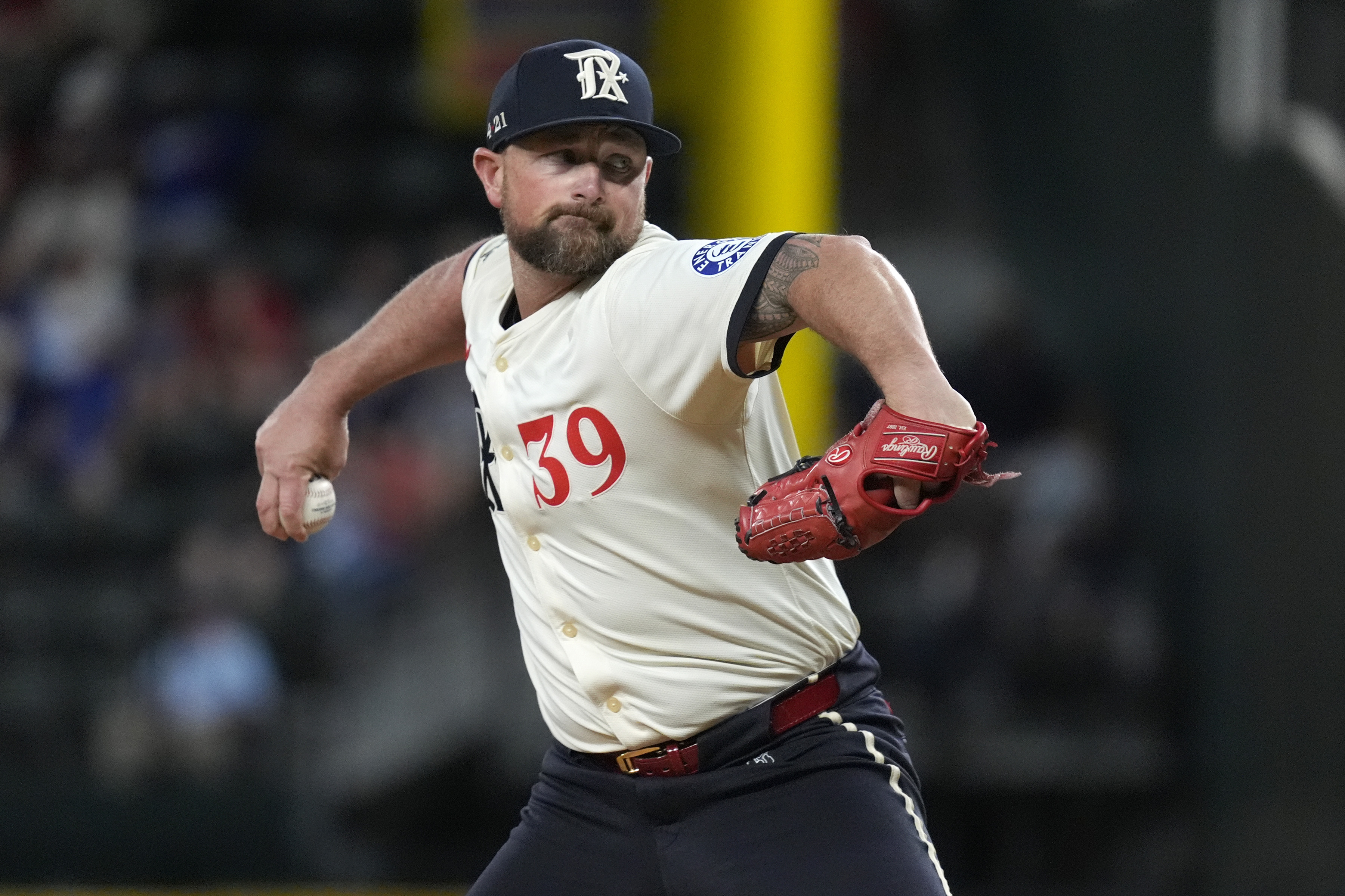 FILE - Texas Rangers closing pitcher Kirby Yates throws during the ninth inning of a baseball game agains the Tampa Bay Rays in Arlington, Texas, on July 5, 2024.