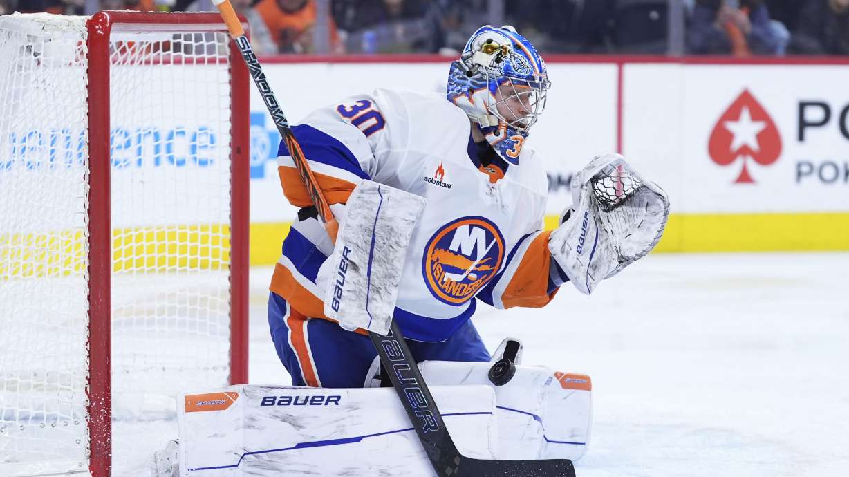 New York Islanders' Ilya Sorokin blocks a shot during the second period of an NHL hockey game against the Philadelphia Flyers, Thursday, Jan. 30, 2025, in Philadelphia.