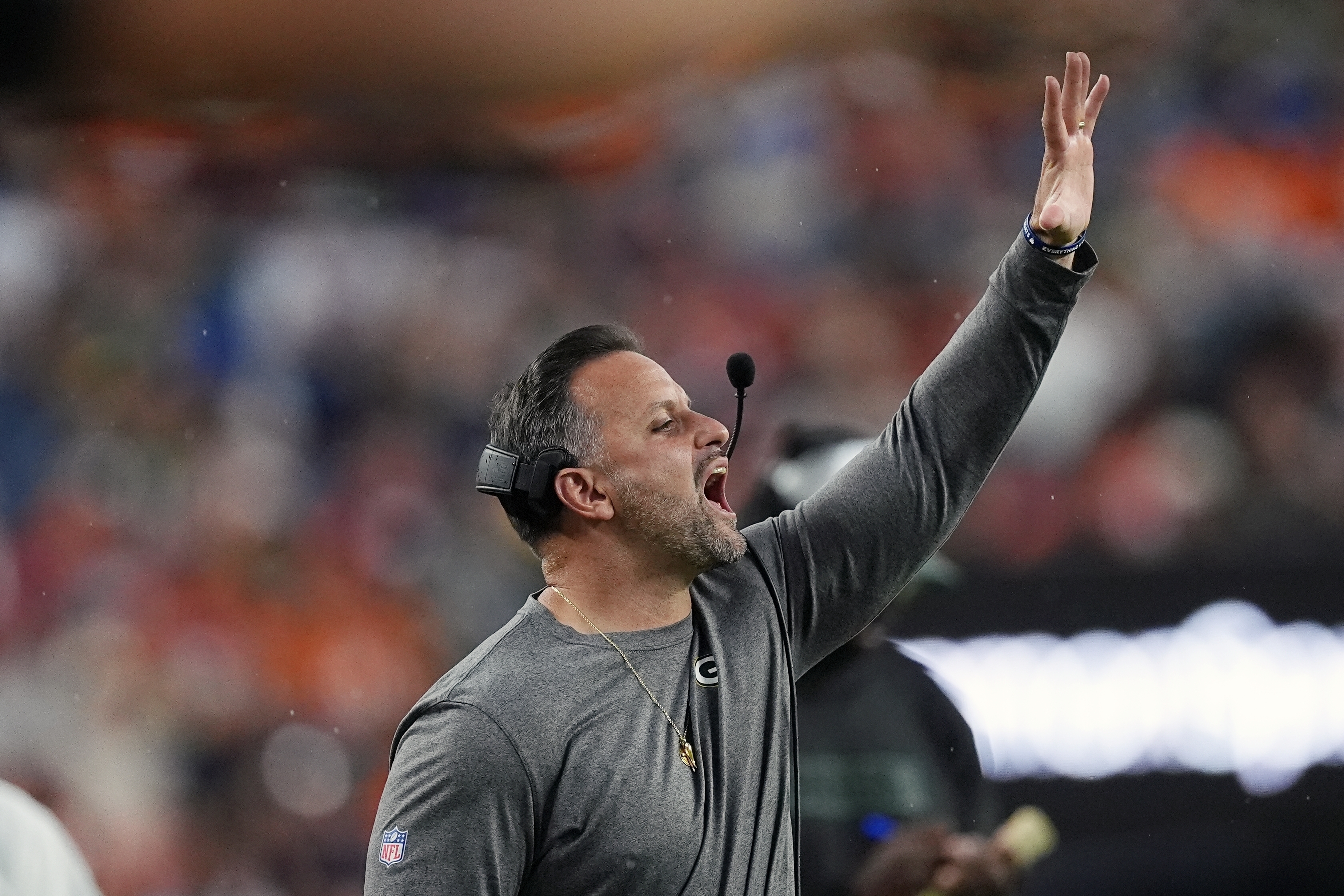 FILE - Green Bay Packers linebackers coach Anthony Campanile yells instructions during the first half of a preseason NFL football game against the Denver Broncos, on Aug. 18, 2024, in Denver.