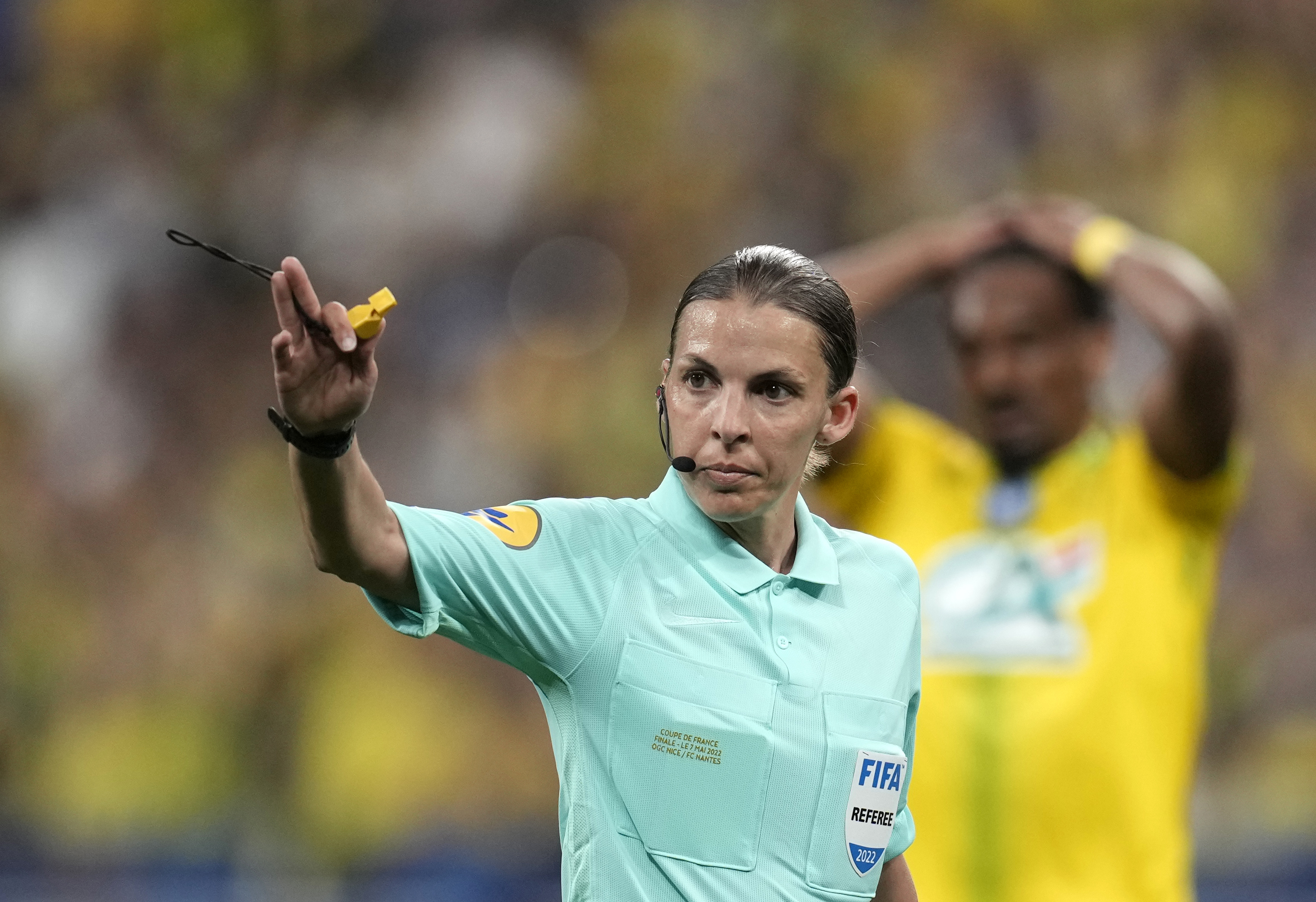 FILE - Referee Stephanie Frappart gives directions during the French Cup final soccer match between Nice and Nantes at the Stade de France stadium, in Saint Denis, north of Paris, Saturday, May 7, 2022. 