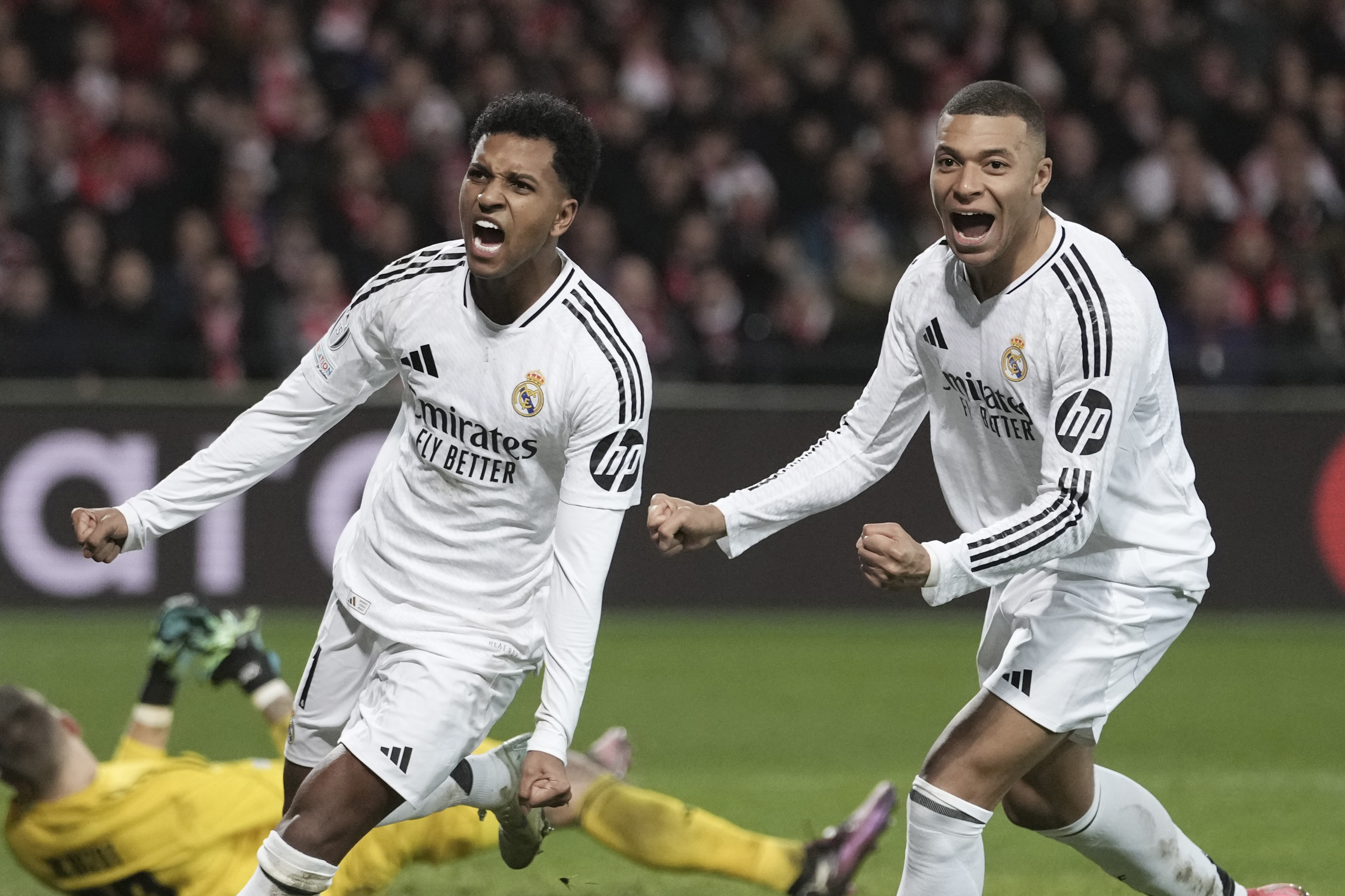 Real Madrid's Rodrygo, left, celebrates with his teammate Kylian Mbappe after scoring his side's third goal during the Champions League opening phase soccer match between Brest and Real Madrid at Roudourou stadium in Guingamp, France, Wednesday, Jan. 29, 2025. 