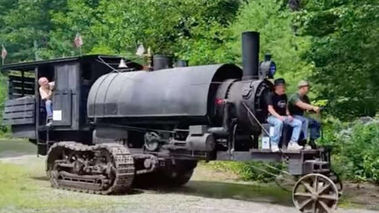 An old-fashioned but refurbished steam-powered log hauler at the Maine Forest and Logging Museum.
