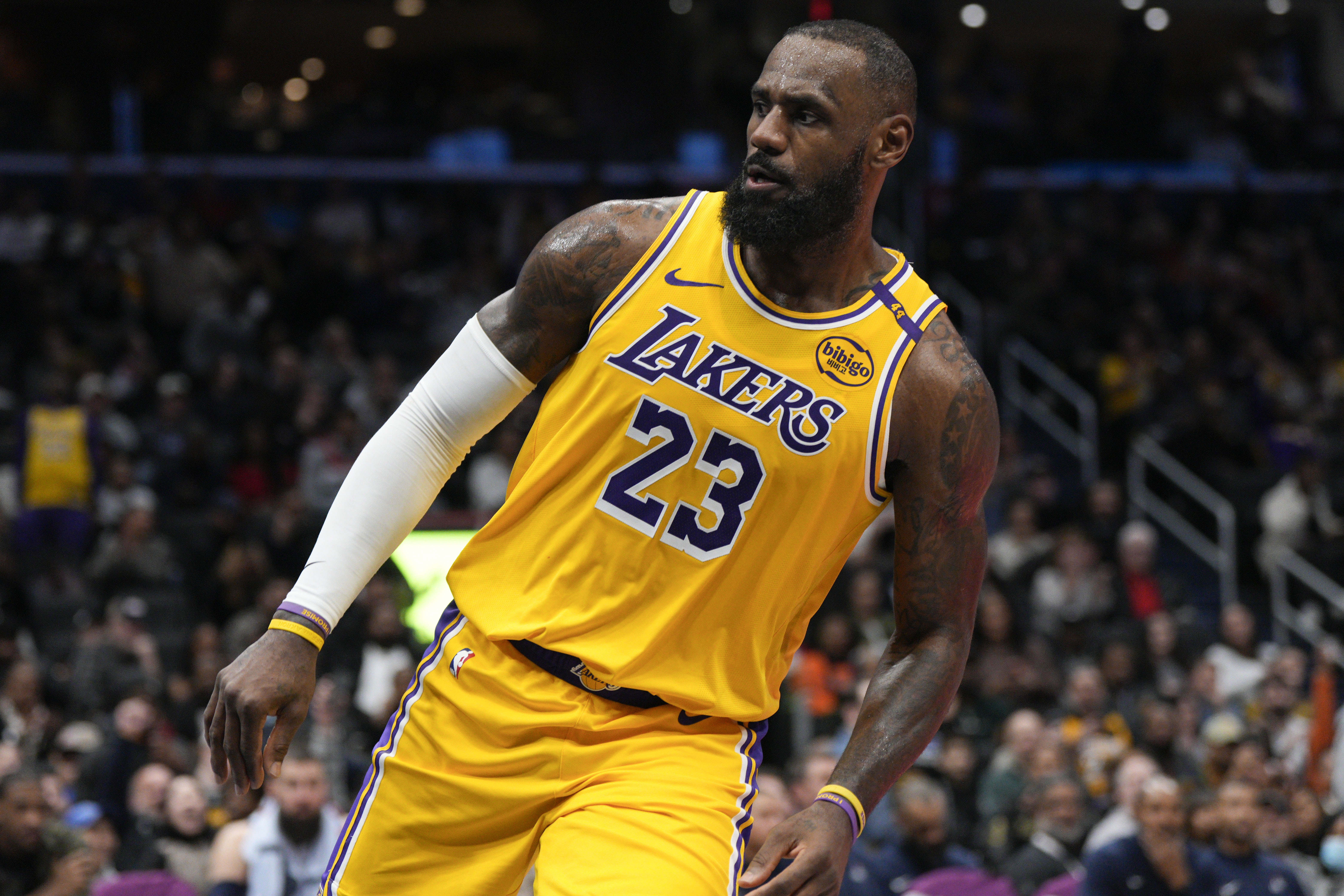Los Angeles Lakers forward LeBron James reacts after dunking against the Washington Wizards during the second half of an NBA basketball game Thursday, Jan. 30, 2025, in Washington. 