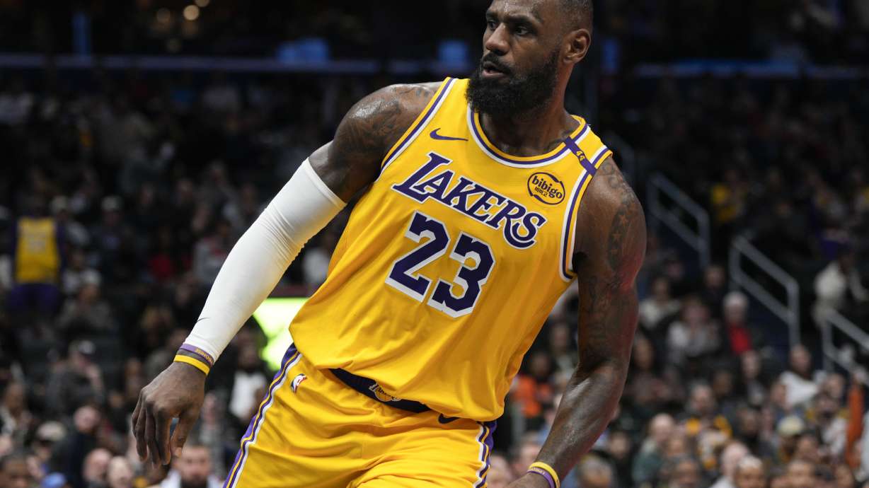 Los Angeles Lakers forward LeBron James reacts after dunking against the Washington Wizards during the second half of an NBA basketball game Thursday, Jan. 30, 2025, in Washington.