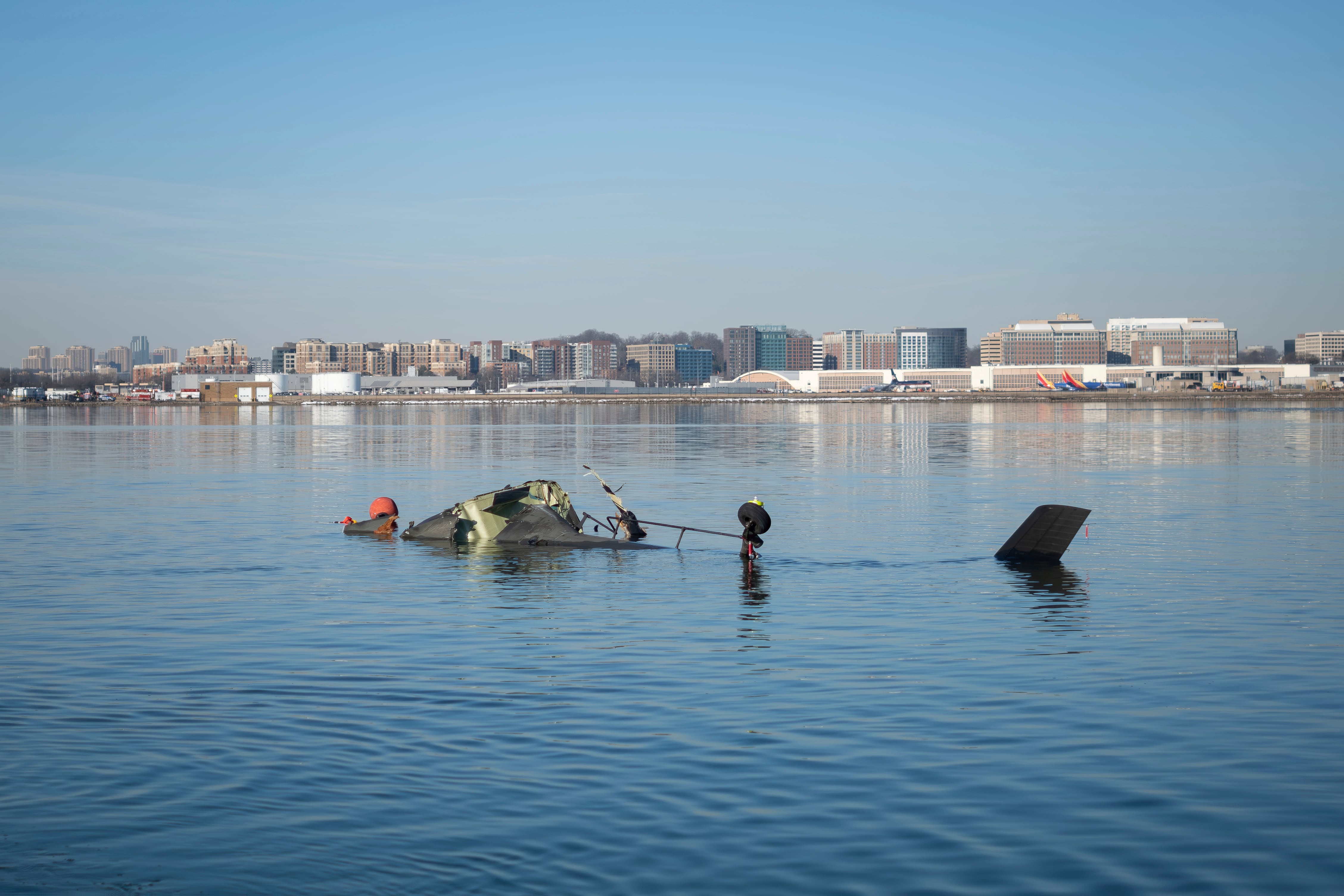In this image provided by the U.S. Coast Guard, wreckage is seen in the Potomac River near Ronald Reagan Washington National Airport, Thursday, in Washington.