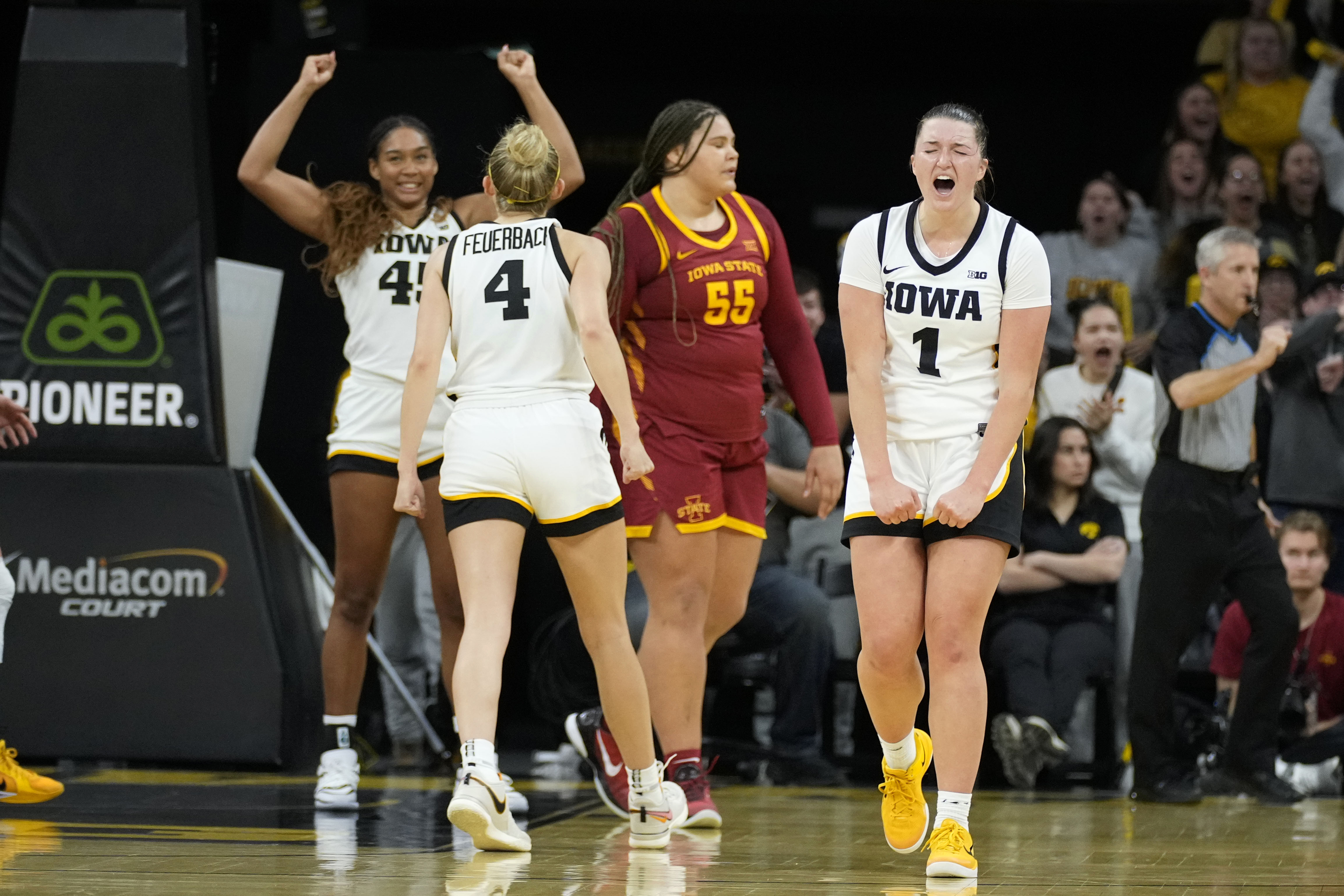 FILE - Iowa guard Taylor Stremlow (1) celebrates at the end of an NCAA college basketball game against Iowa State, Wednesday, Dec. 11, 2024, in Iowa City, Iowa. 