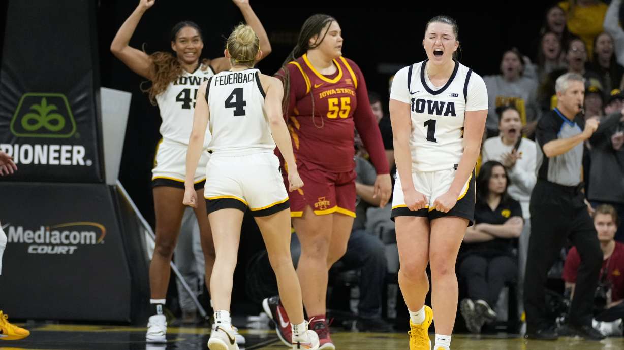 FILE - Iowa guard Taylor Stremlow (1) celebrates at the end of an NCAA college basketball game against Iowa State, Wednesday, Dec. 11, 2024, in Iowa City, Iowa.