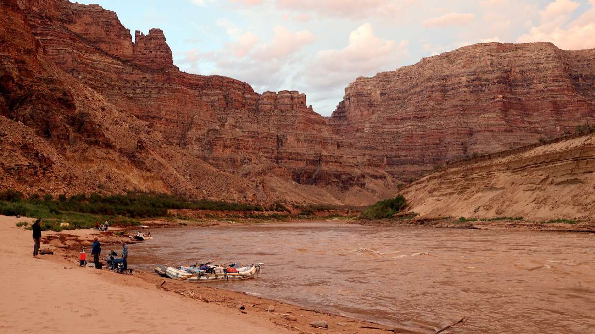 Campers on the banks of the Colorado River in Cataract Canyon on Sept. 21, 2024. A proposed resolution would set the groundwork for Utah to pick up millions in deferred maintenance projects on federal land.