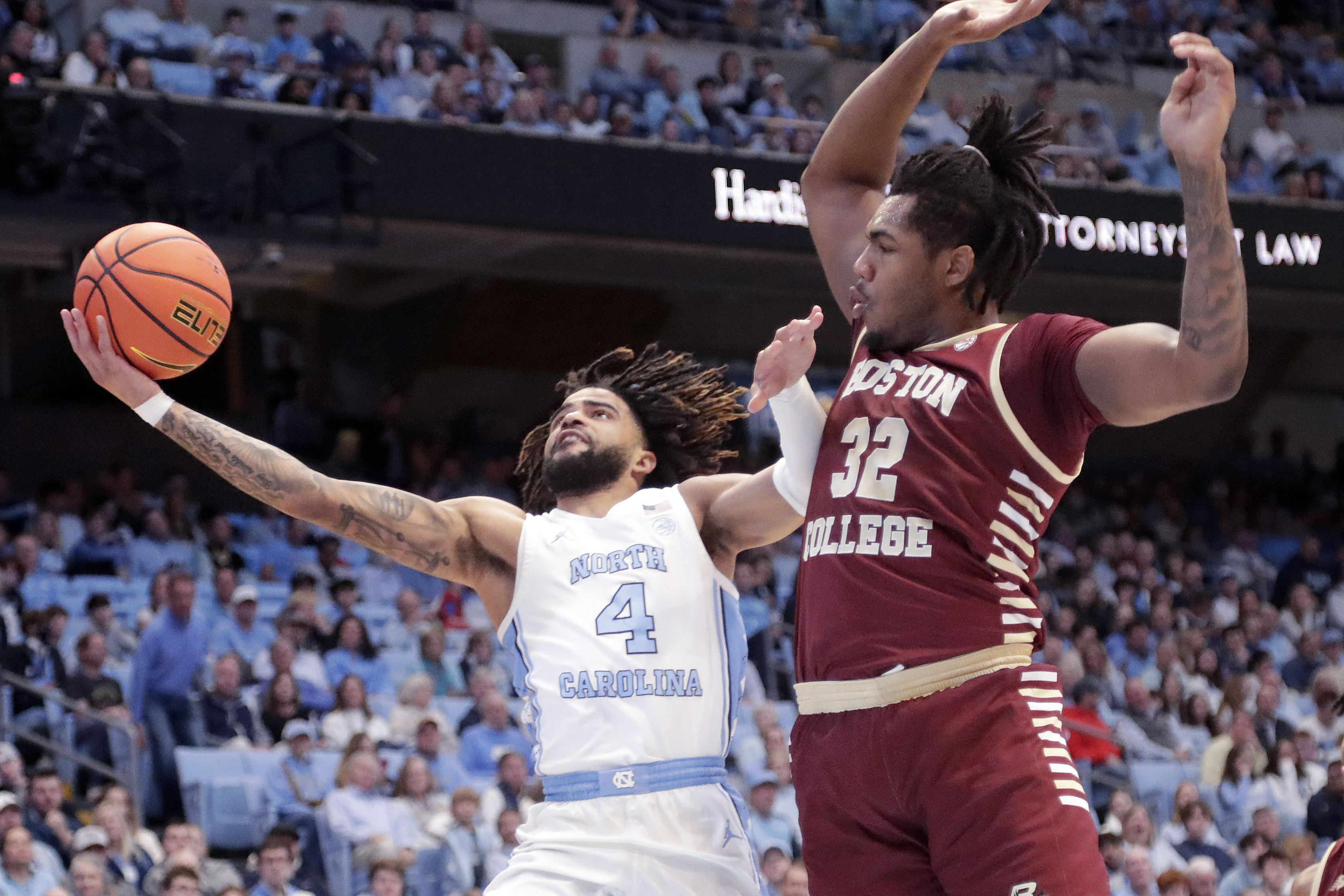 North Carolina guard RJ Davis (4) drives against Boston College forward Chad Venning (32) during the first half of an NCAA college basketball game Saturday, Jan. 25, 2025, in Chapel Hill, N.C. 
