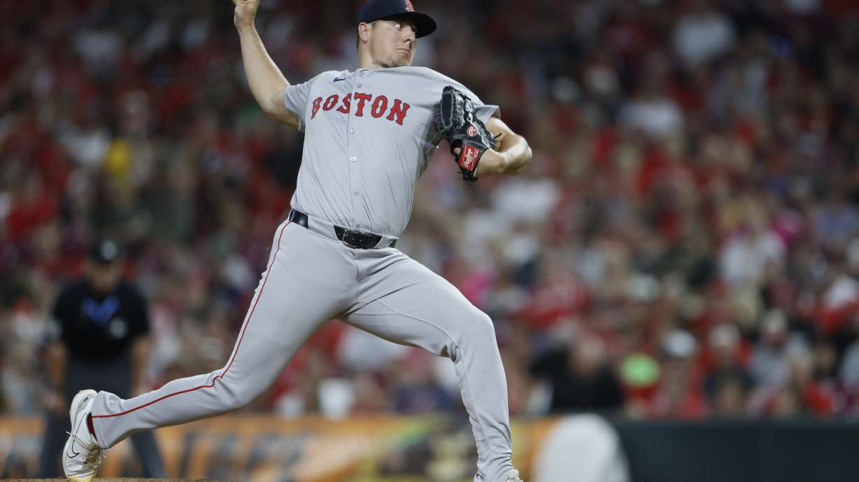 FILE - Boston Red Sox relief pitcher Brad Keller throws against the Cincinnati Reds during the eighth inning of a baseball game Friday, June 21, 2024, in Cincinnati.