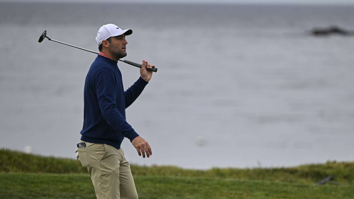 Scottie Scheffler reacts after missing a putt on the fourth hole at Pebble Beach Golf Links during the second round of the AT&T Pebble Beach Pro-Am golf tournament, Friday, Jan. 31, 2025, in Pebble Beach, Calif.