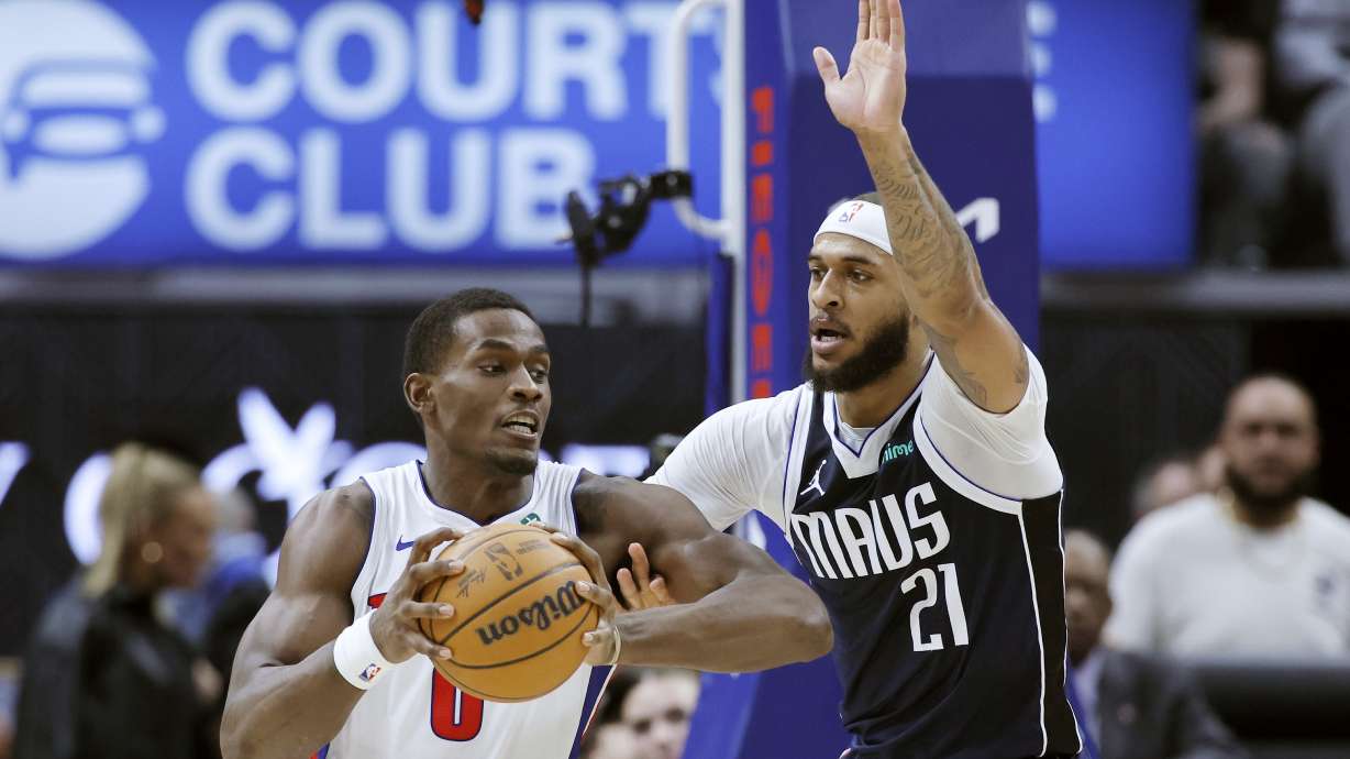Detroit Pistons center Jalen Duren, left, drives to the basket against Dallas Mavericks center Daniel Gafford (21) during the first half of an NBA basketball game Friday, Jan. 31, 2025, in Detroit.