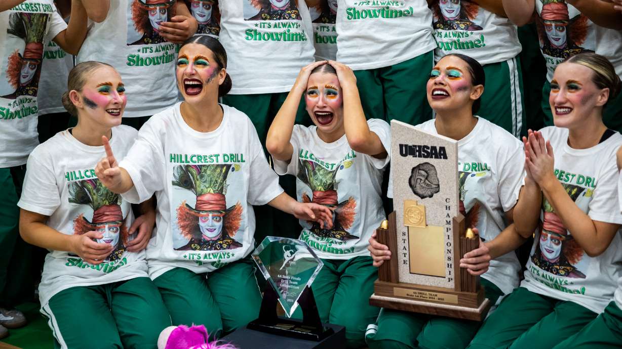 Hillcrest High School drill team members celebrate after winning first place in the show category at UHSAA 4A State Drill Team Finals at UCCU Center in Orem on Friday, Jan. 31, 2025.