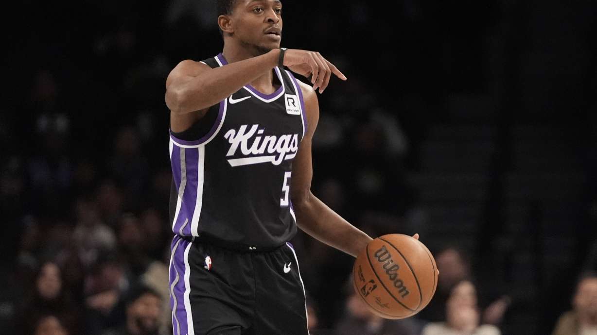 Sacramento Kings' De'Aaron Fox (5) calls out to teammates during the first half of an NBA basketball game against the Brooklyn Nets Monday, Jan. 27, 2025, in New York.