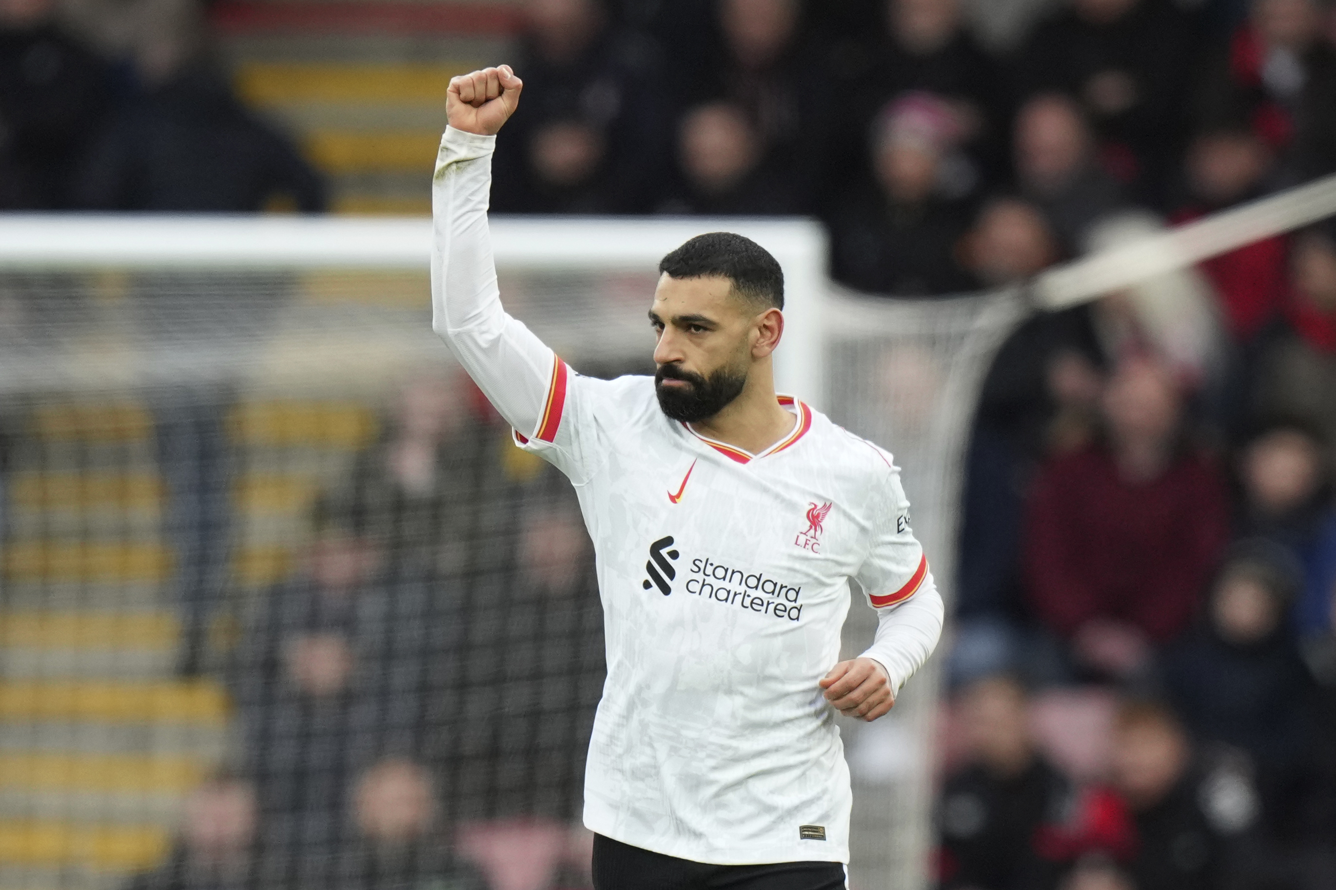Liverpool's Mohamed Salah celebrates after scoring his side's opening goal during the English Premier League soccer match between Bournemouth and Liverpool at the Vitality stadium in Bournemouth, England, Saturday, Feb. 1, 2025.