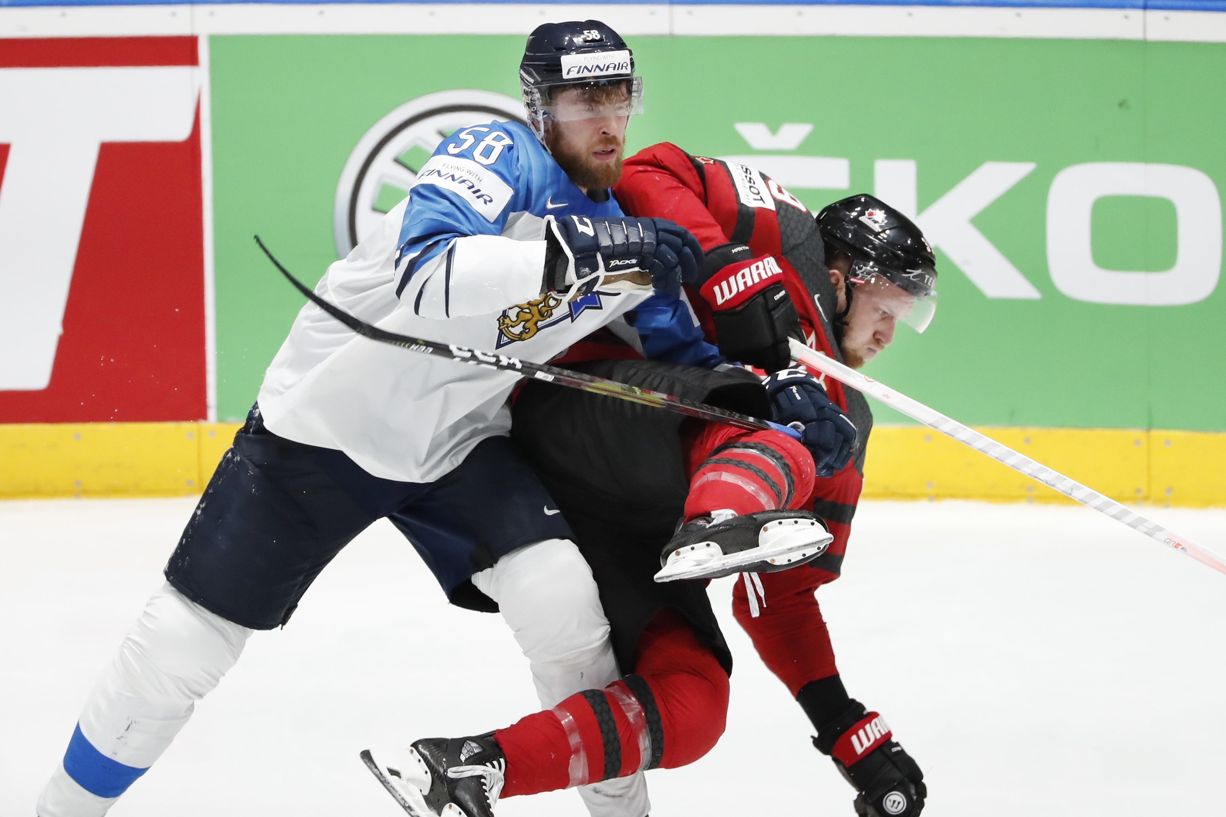 FILE - Finland's Jani Hakanpaa (58) checks Canada's Anthony Mantha, right, during the Ice Hockey World Championships gold medal match at the Ondrej Nepela Arena in Bratislava, Slovakia, Sunday, May 26, 2019.