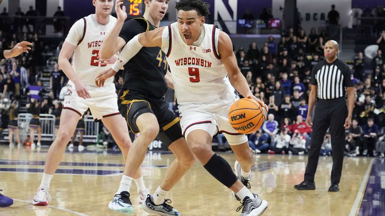 Wisconsin guard John Tonje (9) drives past Northwestern guard Angelo Ciaravino (44) during the first half of an NCAA college basketball game in Evanston, Ill., Saturday, Feb. 1, 2025.
