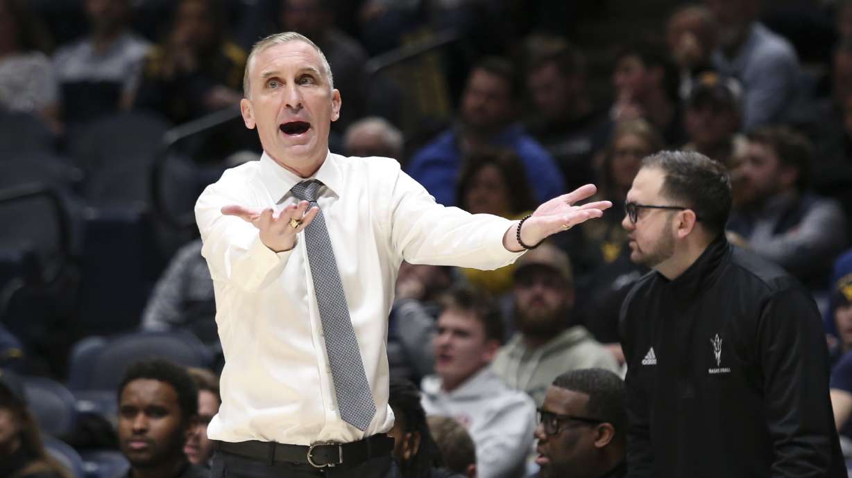 Arizona State head coach Bobby Hurley reacts during the first half of an NCAA college basketball game against West Virginia, Tuesday, Jan. 21, 2025, in Morgantown, W.Va.