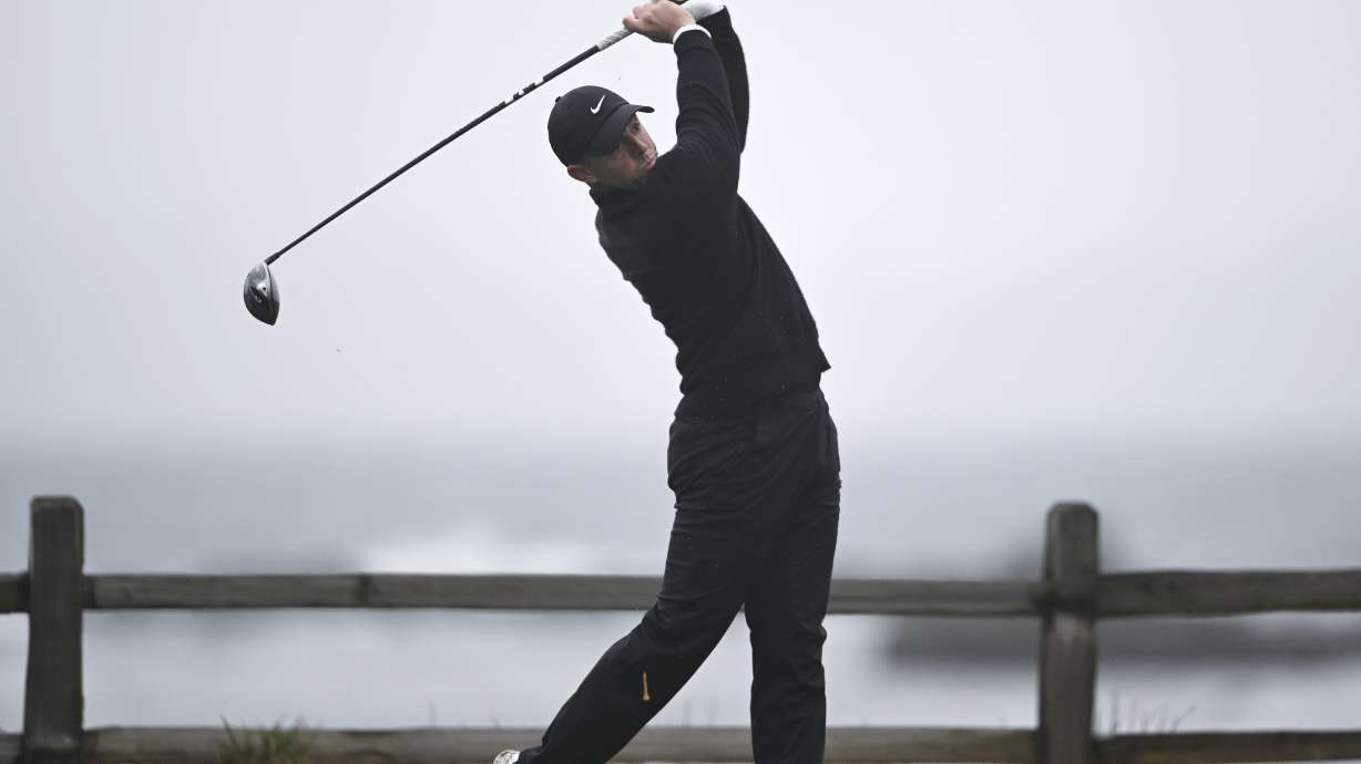 Rory McIlroy, of Northern Ireland, hits his tee shot on the 18th hole at Pebble Beach Golf Links during the third round of the AT&T Pebble Beach Pro-Am golf tournament, Saturday, Feb. 1, 2025, in Pebble Beach, Calif.