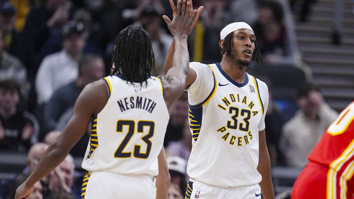 Indiana Pacers center Myles Turner (33) celebrates a basket and being fouled against the Atlanta Hawks during the first half of an NBA basketball game in Indianapolis, Saturday, Feb. 1, 2025.