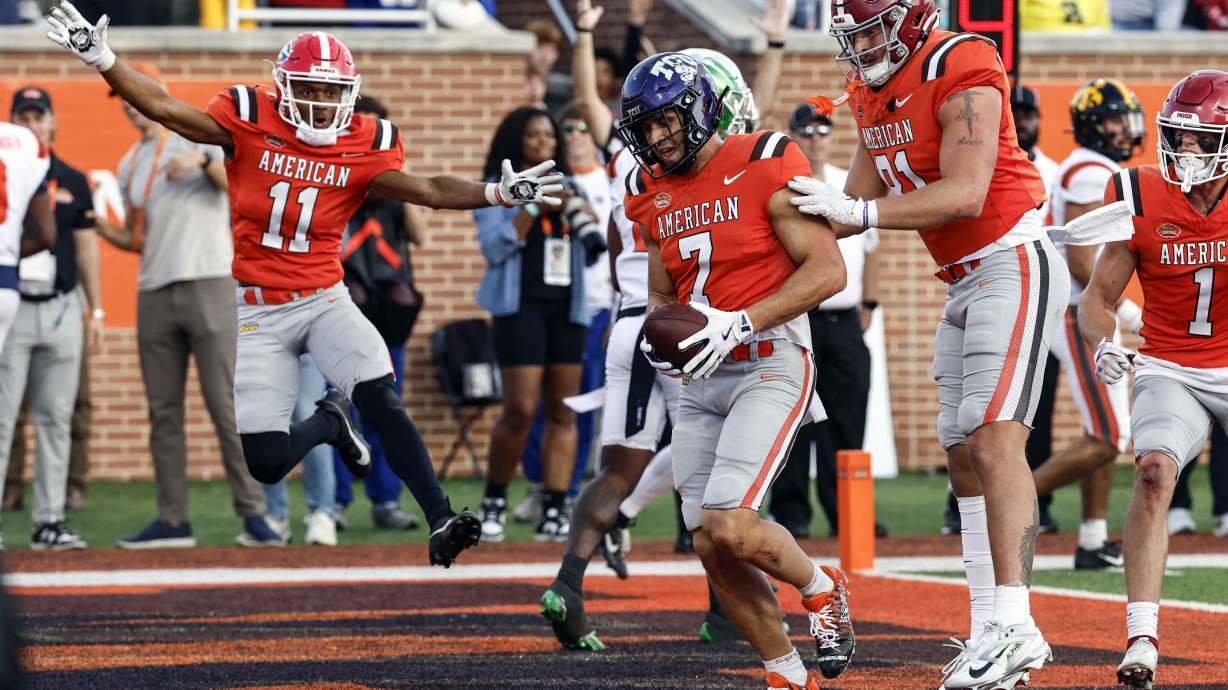 American team wide receiver Jack Bech (7), of TCU, celebrates with teammates after scoring the winning touchdown over the National team during the second half of the Senior Bowl NCAA college football game, Saturday, Feb. 1, 2025, in Mobile, Ala.