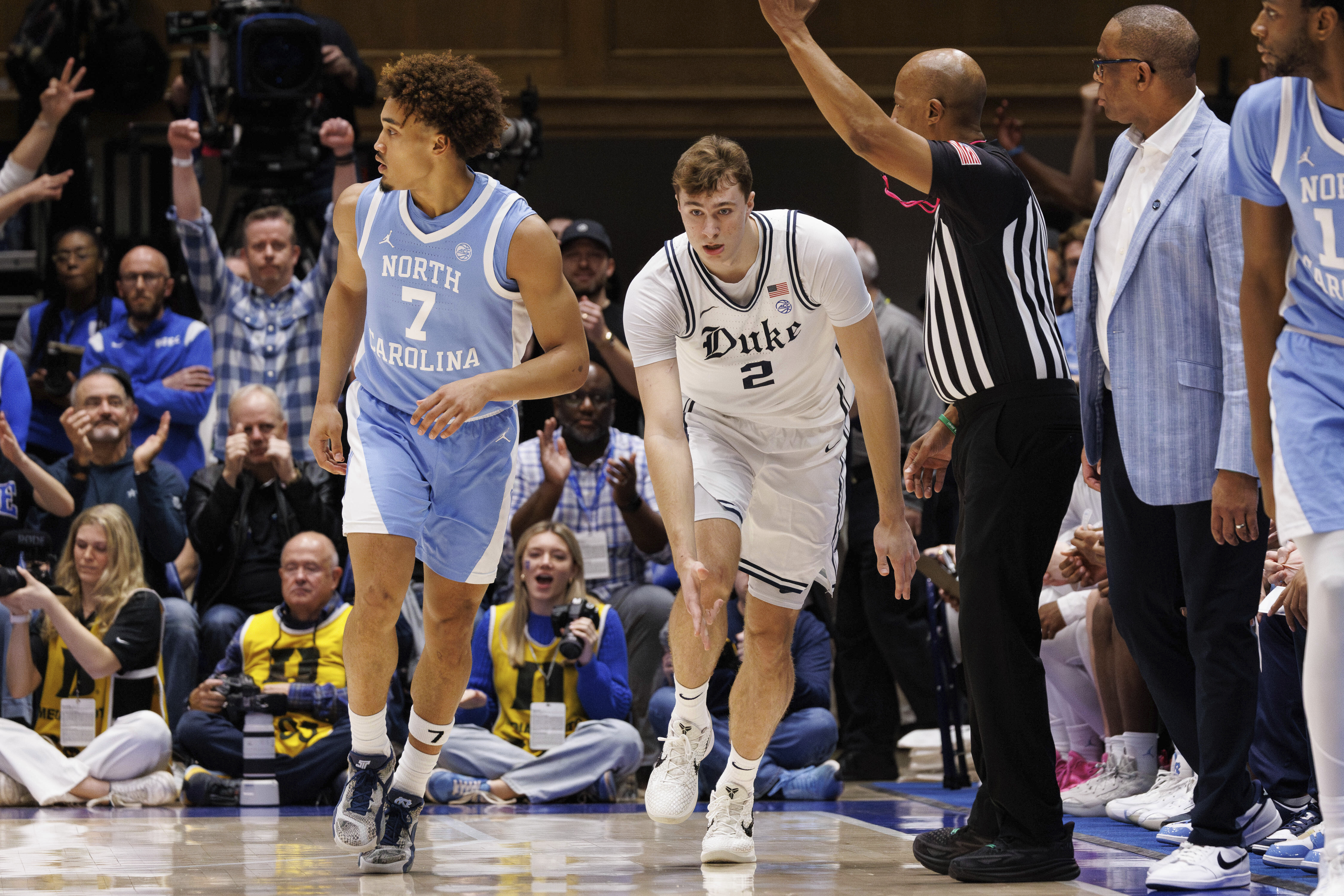 Duke's Cooper Flagg (2) celebrates after hitting a 3-point basket against North Carolina's Seth Trimble (7) during the first half of an NCAA college basketball game in Durham, N.C., Saturday, Feb. 1, 2025. 