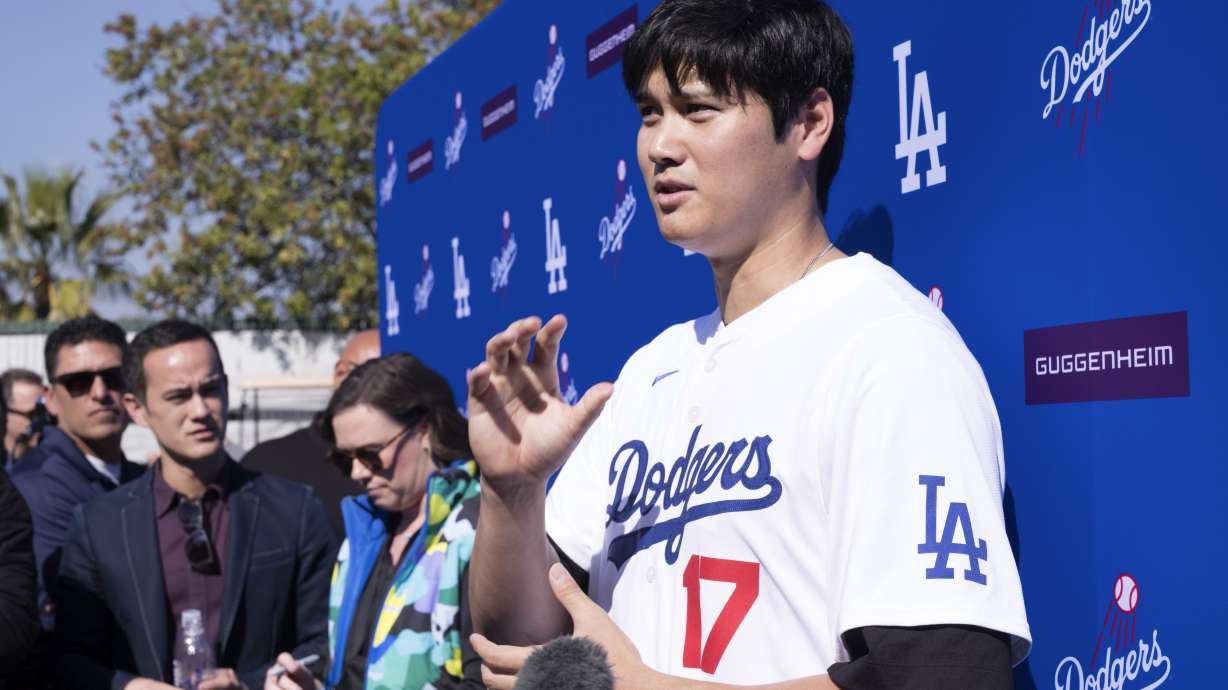 Los Angeles Dodgers' Shohei Ohtani talks to the media during a baseball interview during DodgerFest at Dodger Stadium, Saturday, Feb. 1, 2025, in Los Angeles.