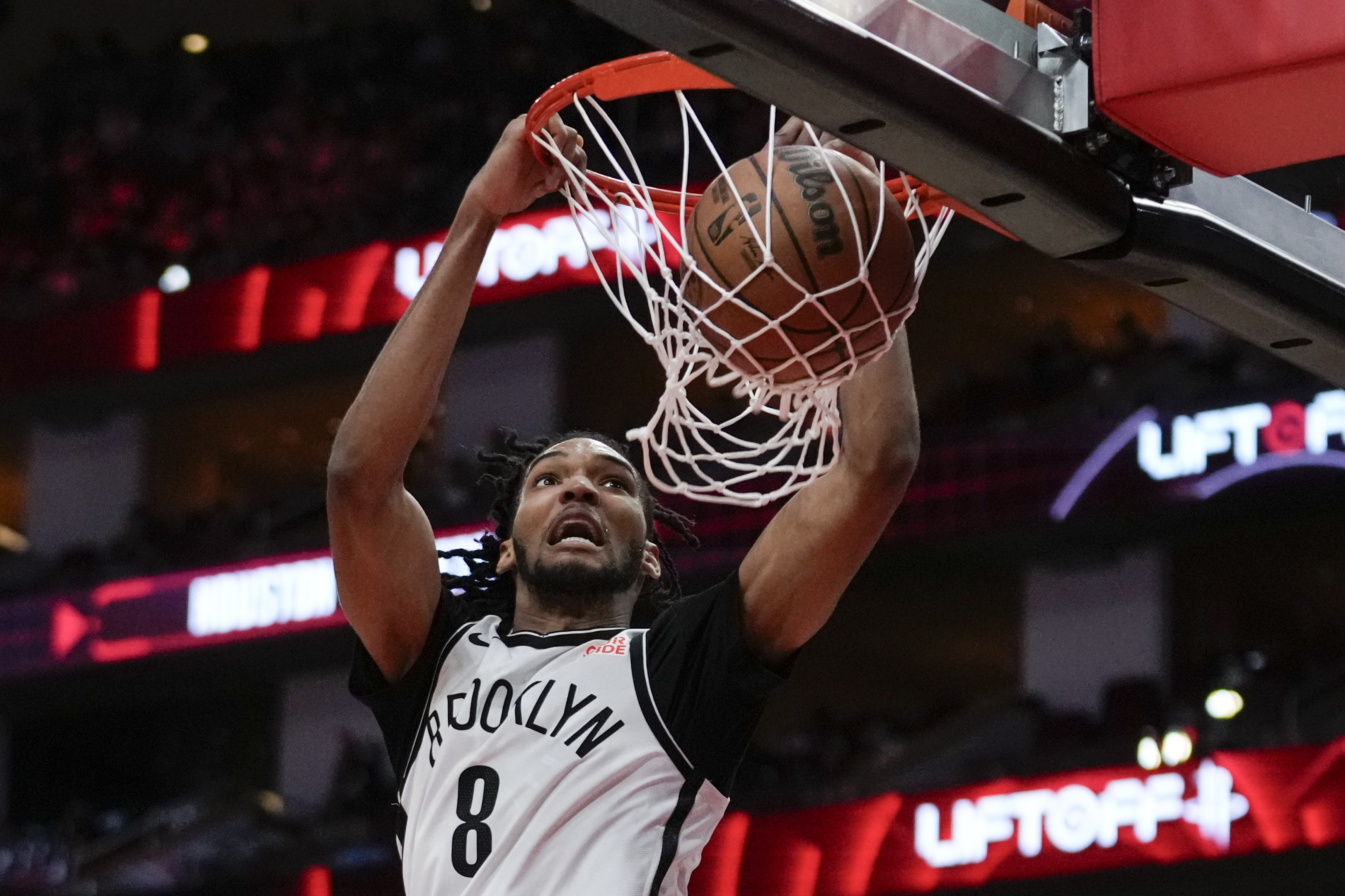 Brooklyn Nets forward Ziaire Williams (8) dunks during the first half of an NBA basketball game against the Houston Rockets in Houston, Saturday, Feb. 1, 2025. 