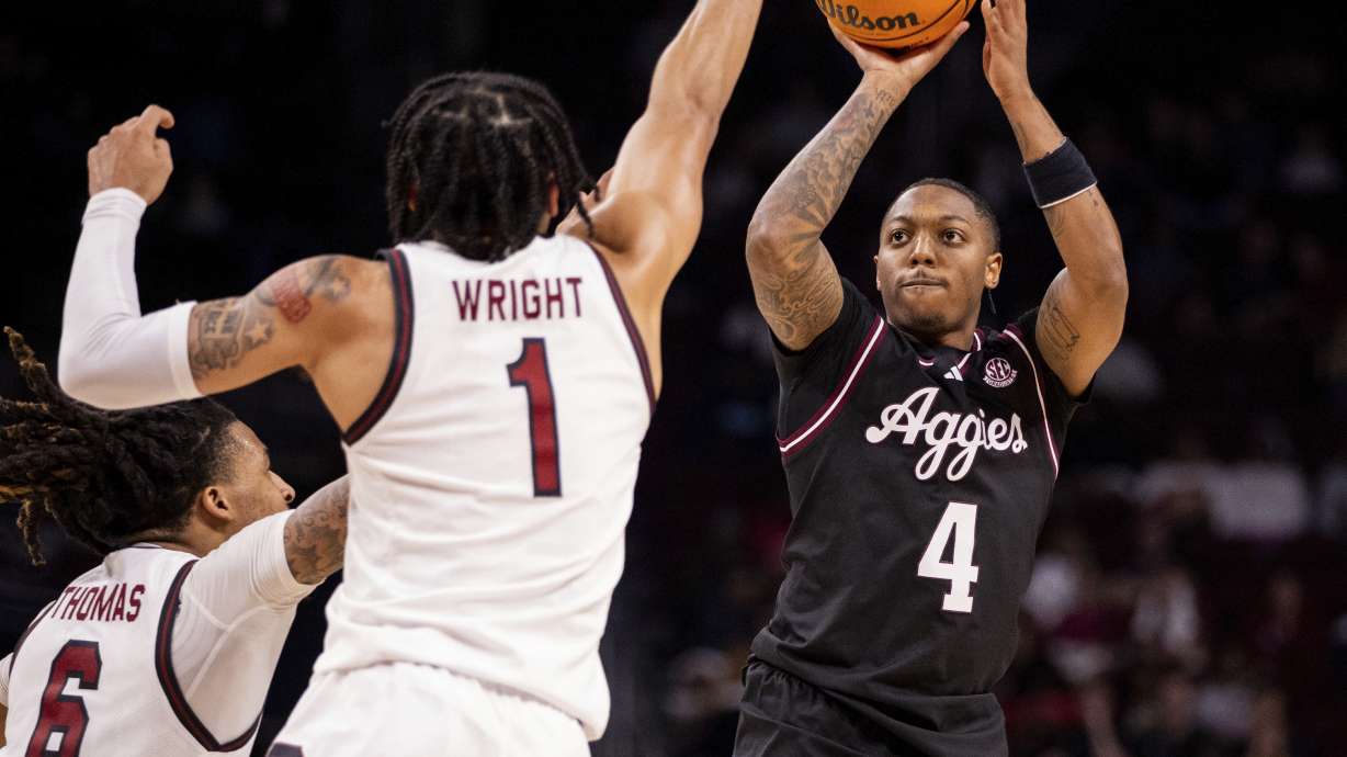 Texas A&M guard Wade Taylor IV (4) shoots against South Carolina during the first half of an NCAA college basketball game Saturday, Feb. 1, 2025, in Columbia, S.C.