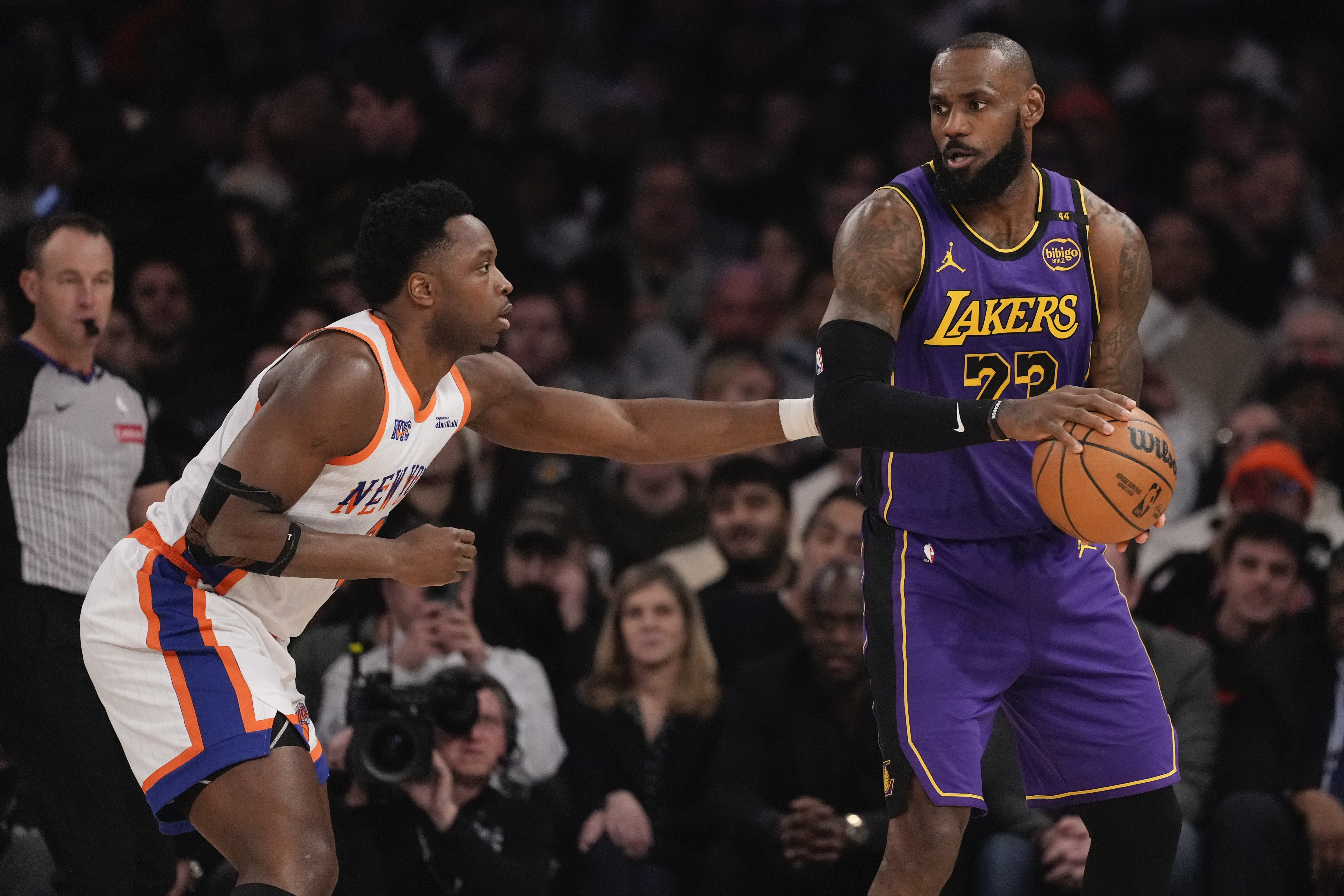 New York Knicks' OG Anunoby (8) defends Los Angeles Lakers' LeBron James (23) during the first half of an NBA basketball game Saturday, Feb. 1, 2025, in New York. 