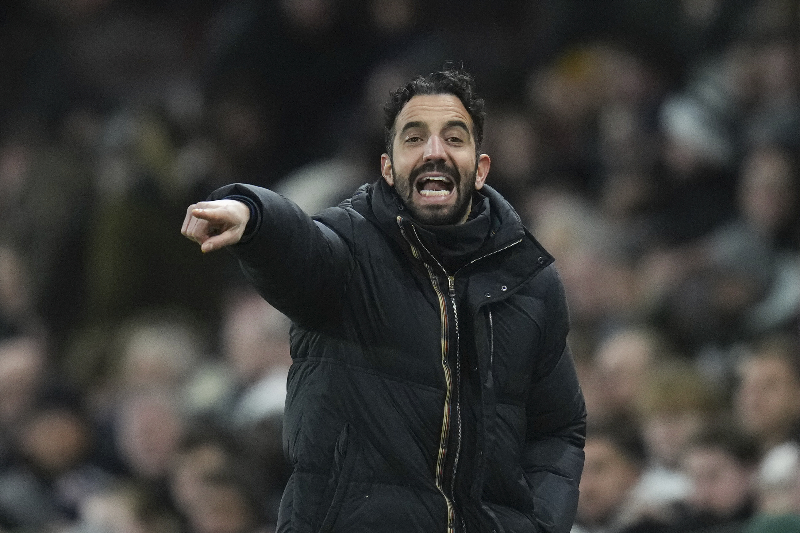 Manchester United's head coach Ruben Amorim gives instructions during the English Premier League soccer match between Fulham and Manchester United at Craven Cottage stadium in London, Sunday, Jan. 26, 2025. 