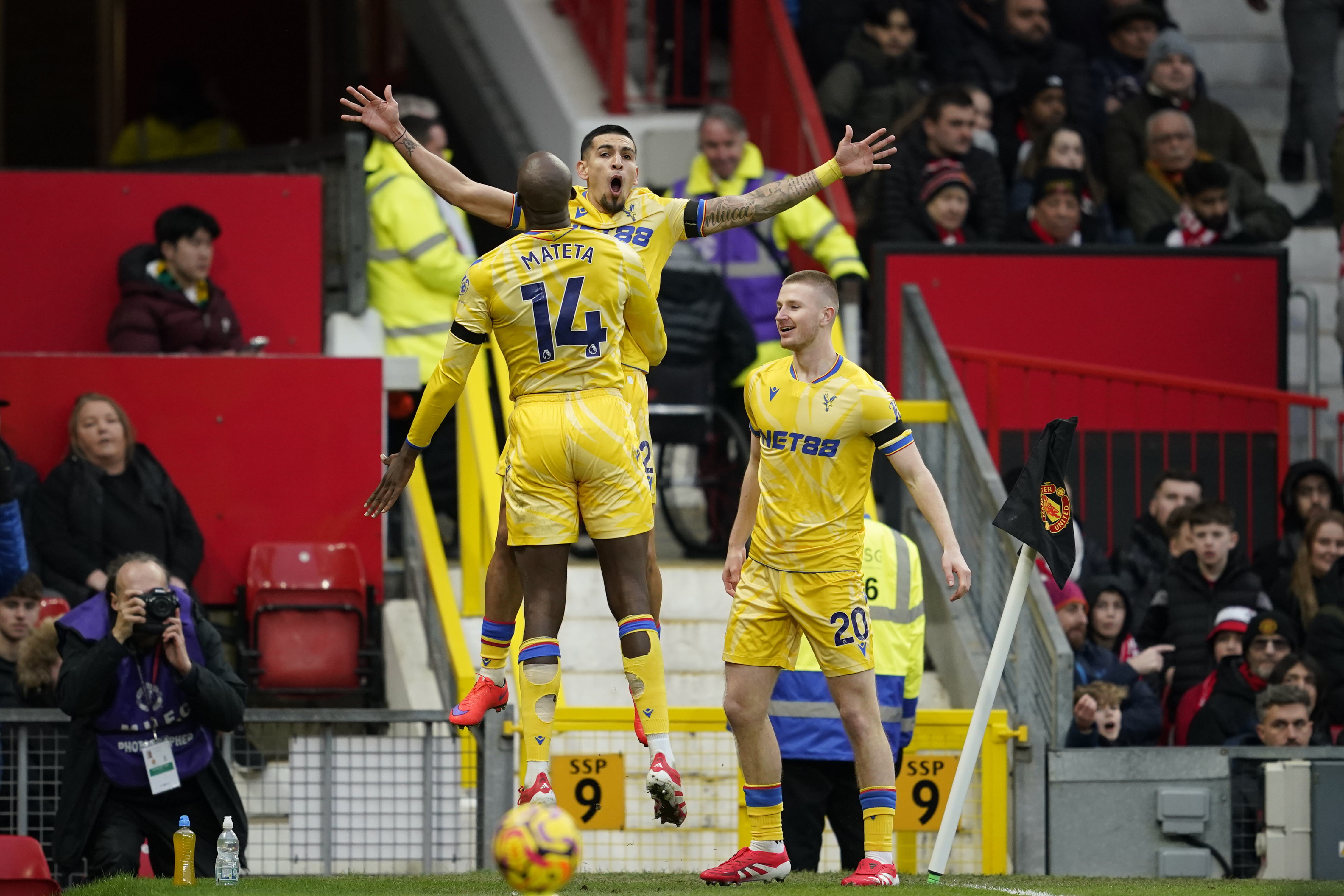 Crystal Palace's Jean-Philippe Mateta (14) celebrates with teammates after scoring his side's second goal during the English Premier League soccer match between Manchester United and Crystal Palace at Old Trafford stadium in Manchester, England, Sunday, Feb. 2, 2025. 