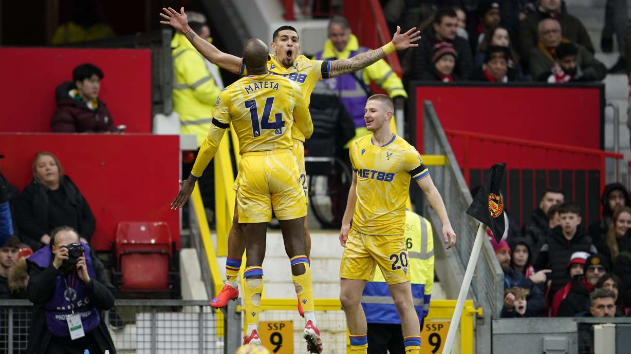 Crystal Palace's Jean-Philippe Mateta (14) celebrates with teammates after scoring his side's second goal during the English Premier League soccer match between Manchester United and Crystal Palace at Old Trafford stadium in Manchester, England, Sunday, Feb. 2, 2025.