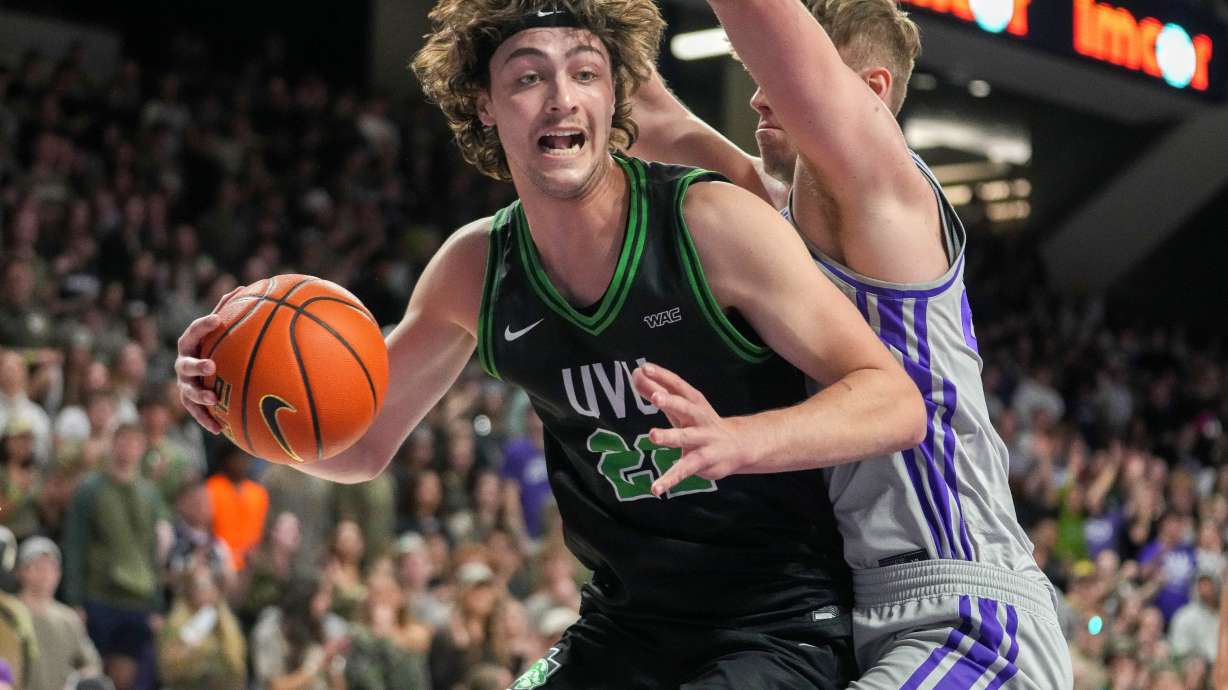 Carter Welling backing down a GCU defender in hopes to reach the bucket.