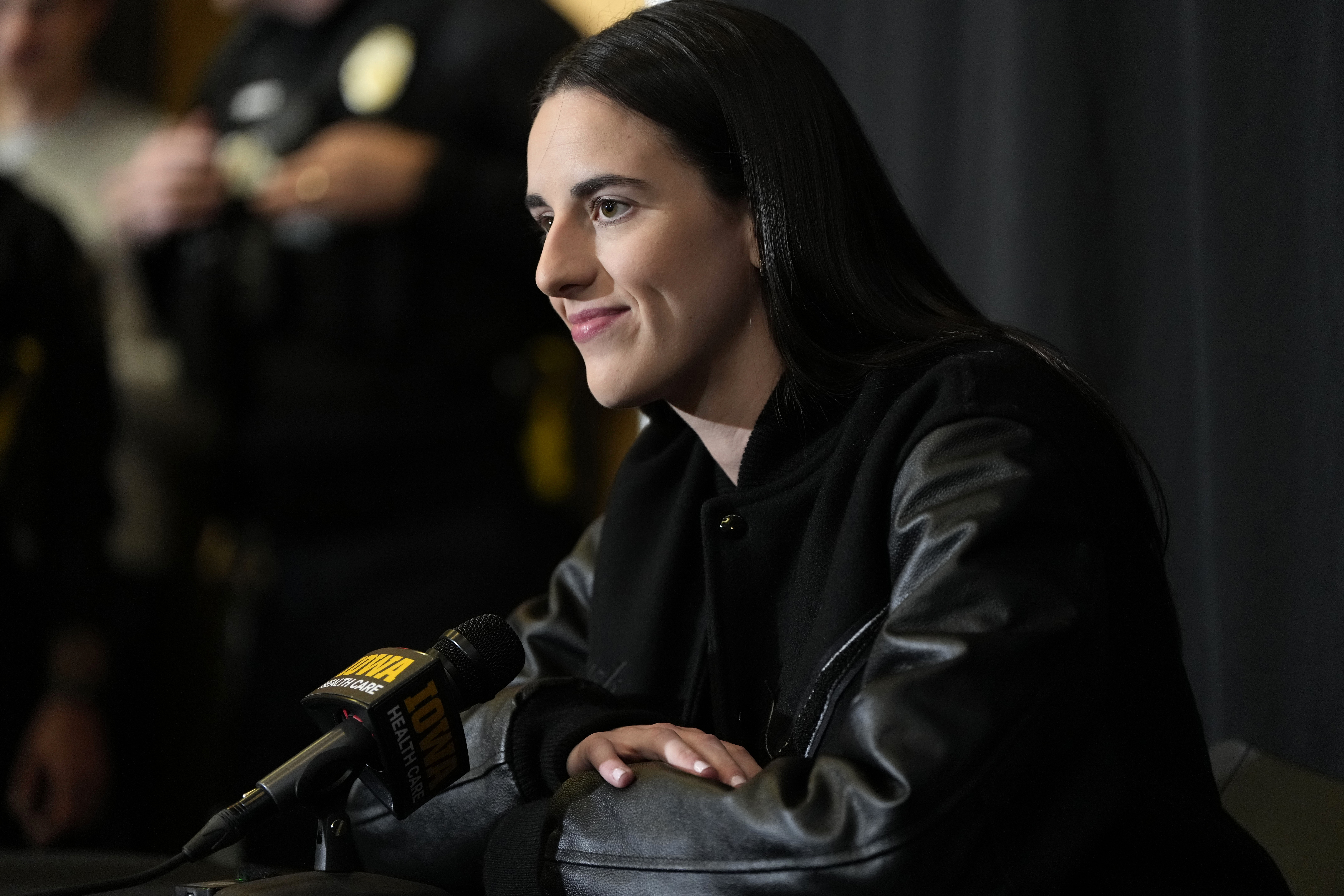 Former Iowa guard and current Indiana Fever WNBA player Caitlin Clark speaks during a news conference before an NCAA college basketball game between Iowa and USC, Sunday, Feb. 2, 2025, in Iowa City, Iowa. 